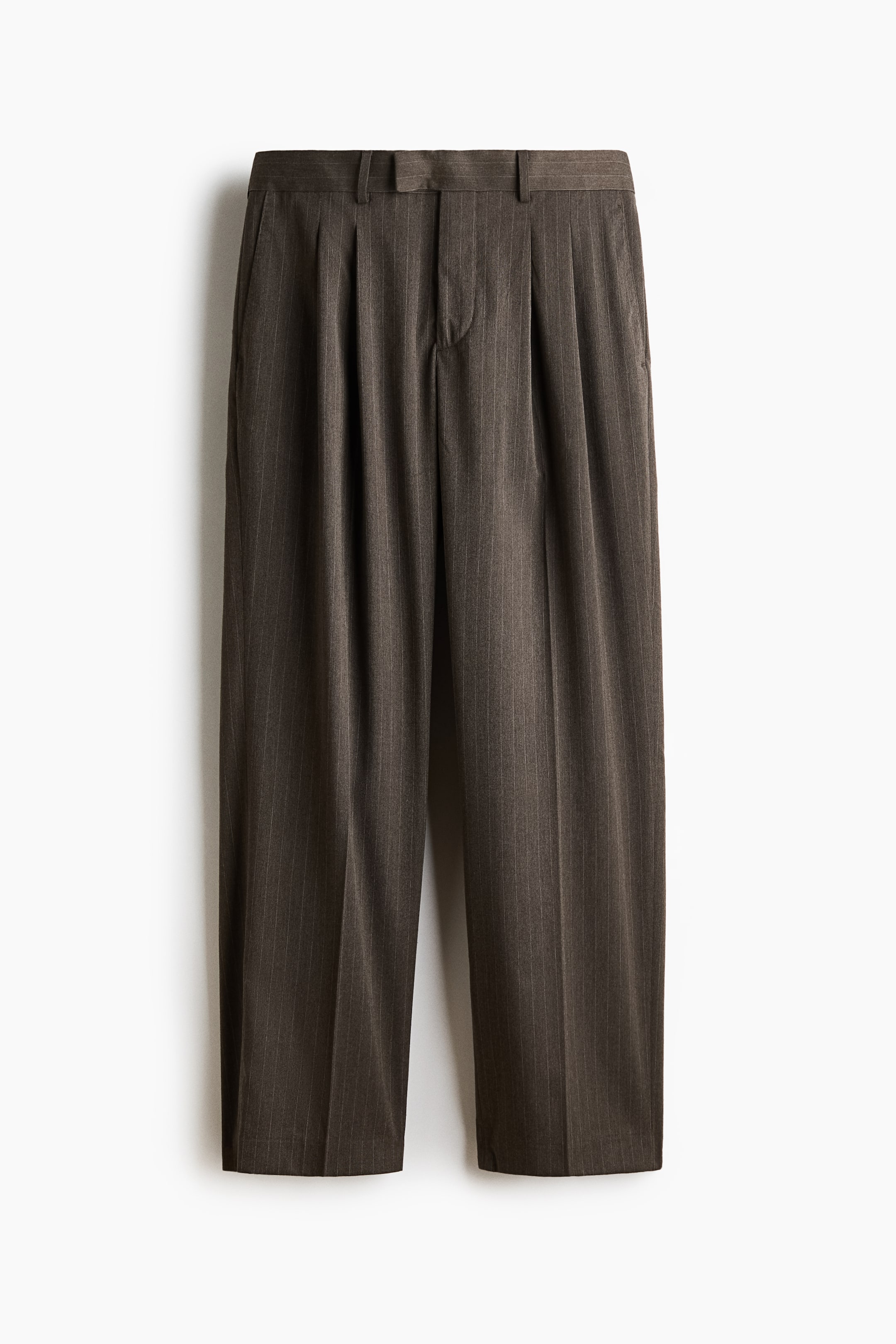 View larger image: The trousers are shown from the front, featuring dark brown pinstriped fabric. They showcase a flat waistband with belt loops, double front pleats, side pockets, and a center crease running down each leg.