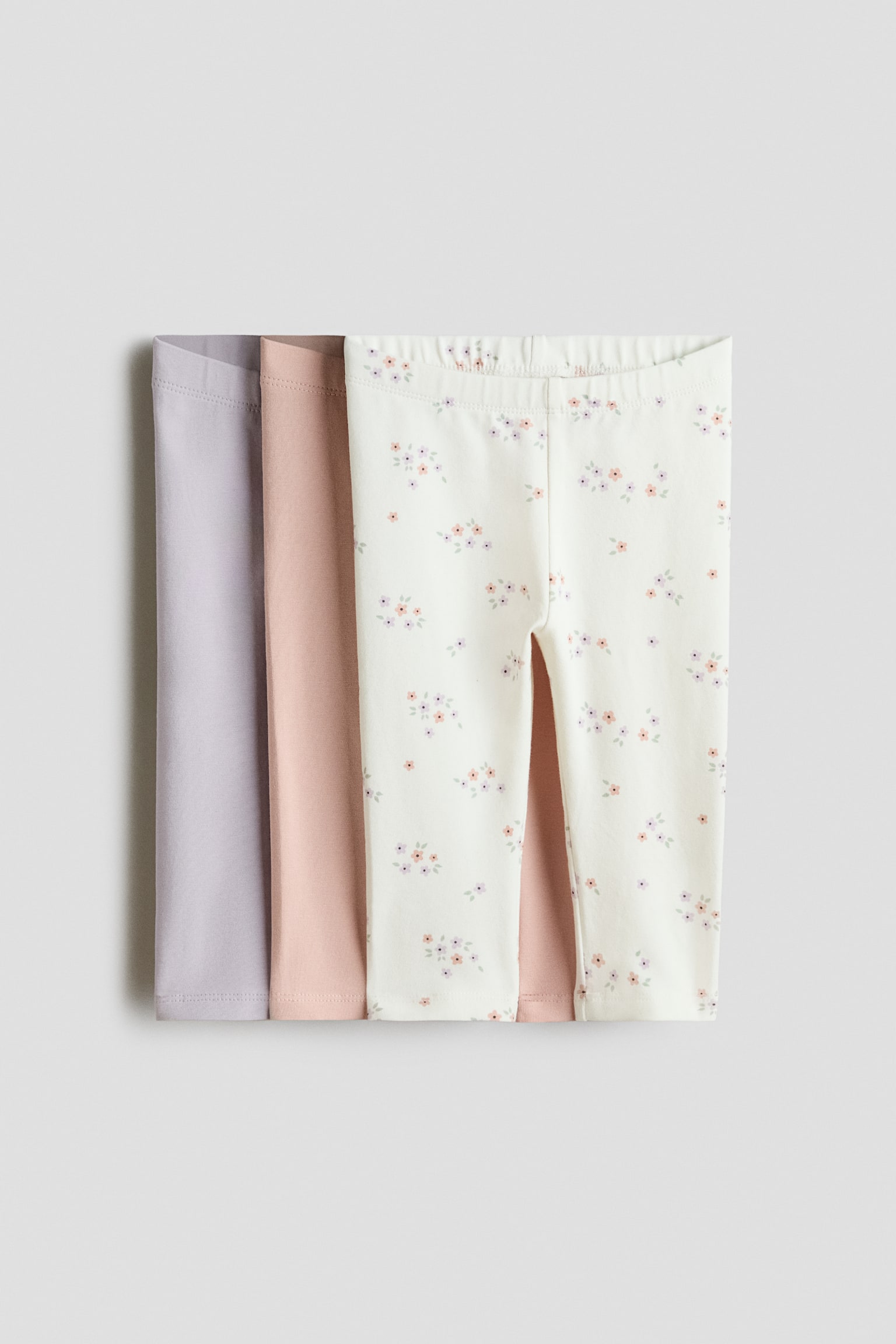 Pack de 3 leggings em jersey de algodão - Lilás claro/Floral/Vermelho/Corações/Bege/Cinzento/Coalas/Lilás/Cerejas/Azul claro/Dinossauros/Turquesa/Dinossauros/Rosa claro/Floral