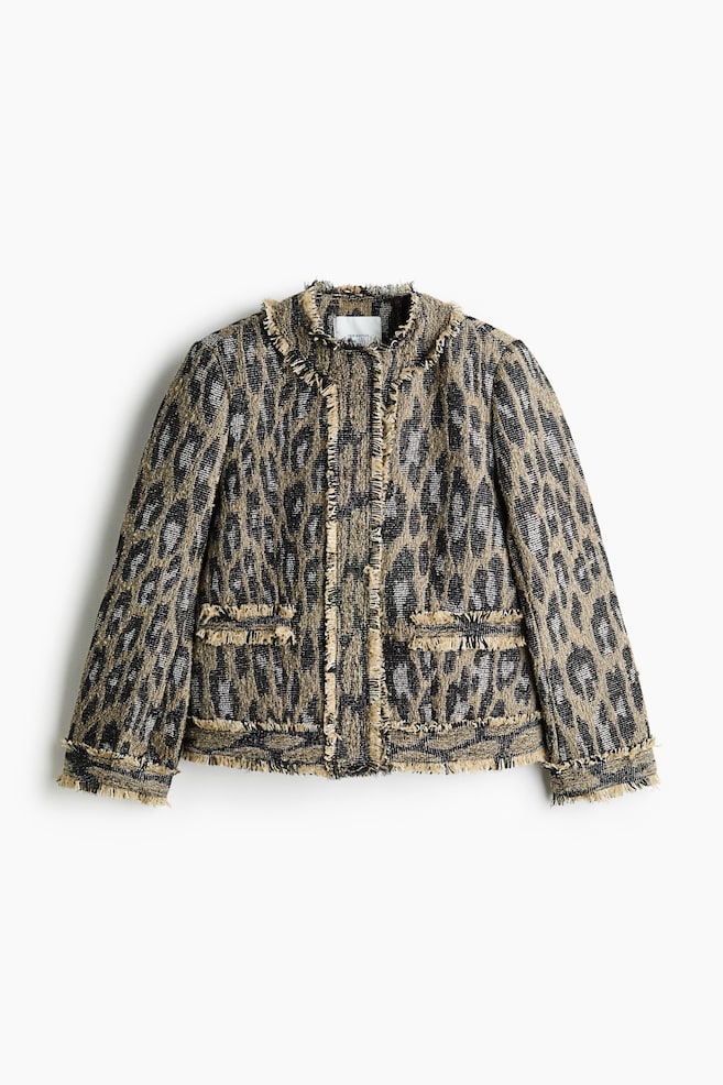 A front-facing jacket in a textured, leopard-patterned jacquard weave featuring a round neckline and long sleeves. It is designed with prominent frayed trims lining the collar, front fastening, cuffs, hem, and two front welt pockets. - 1