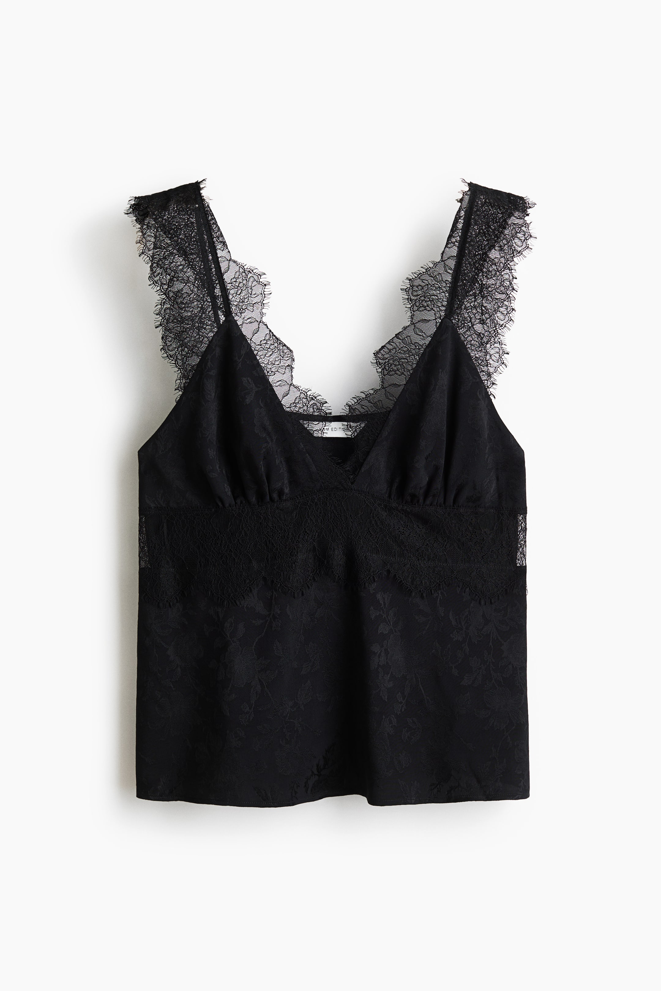 View larger image: A black top features a jacquard weave with a subtle sheen. It has a V-neckline with lace trim extending over the shoulder straps, and gathered cups sit above a sheer lace panel.