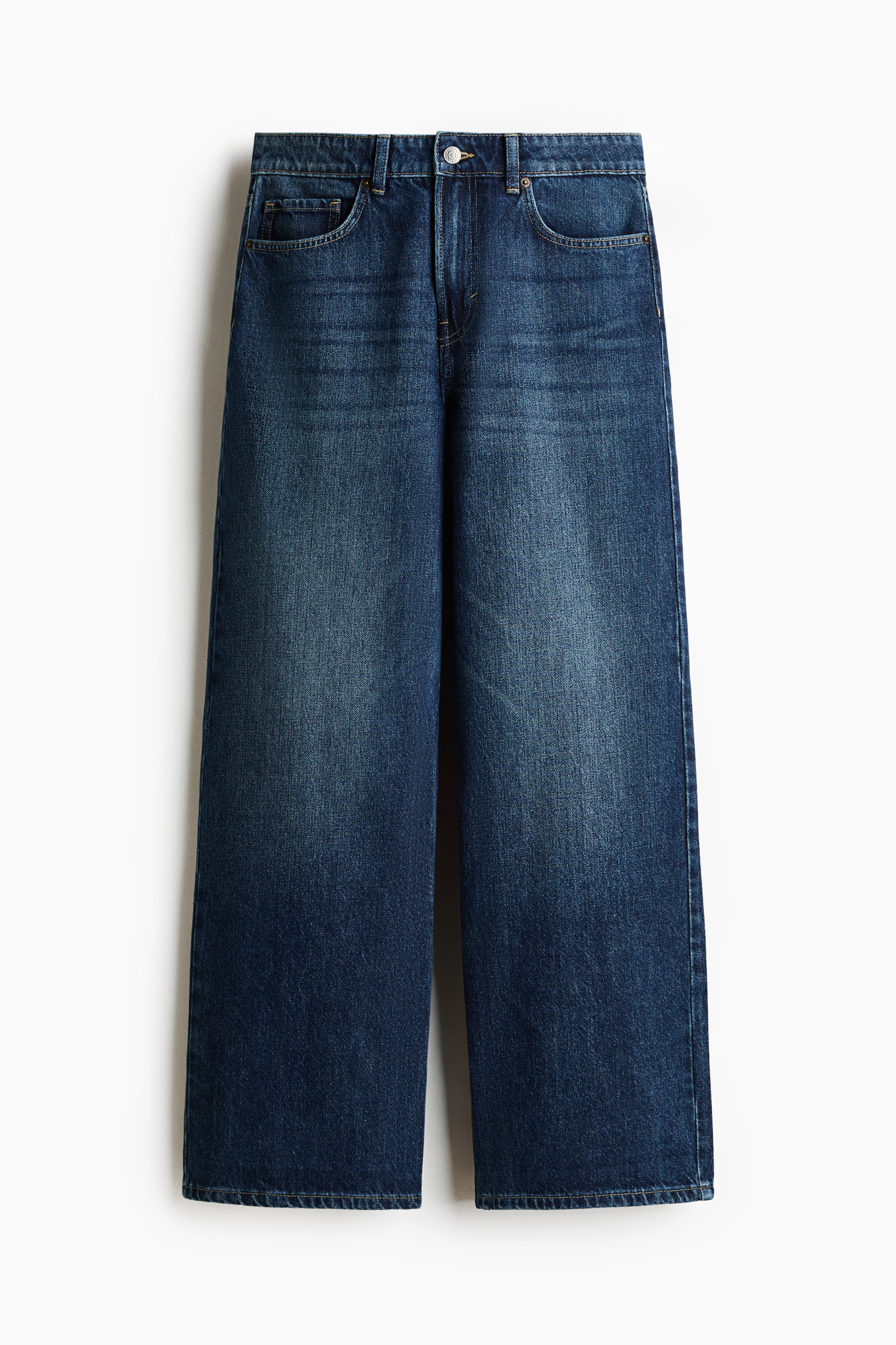 View larger image: The dark blue wide-leg denim jeans feature a high waist, a button and zipper closure, belt loops, two front scoop pockets with a coin pocket, and subtle fading on the upper thighs.