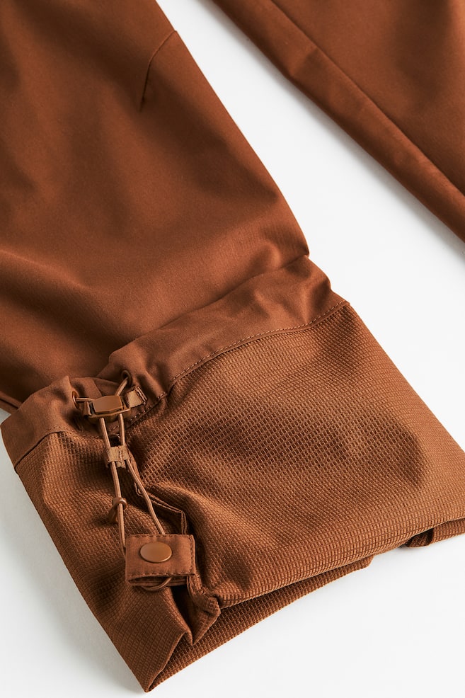 Water-repellent zip-off hiking trousers - Brown/Black - 12