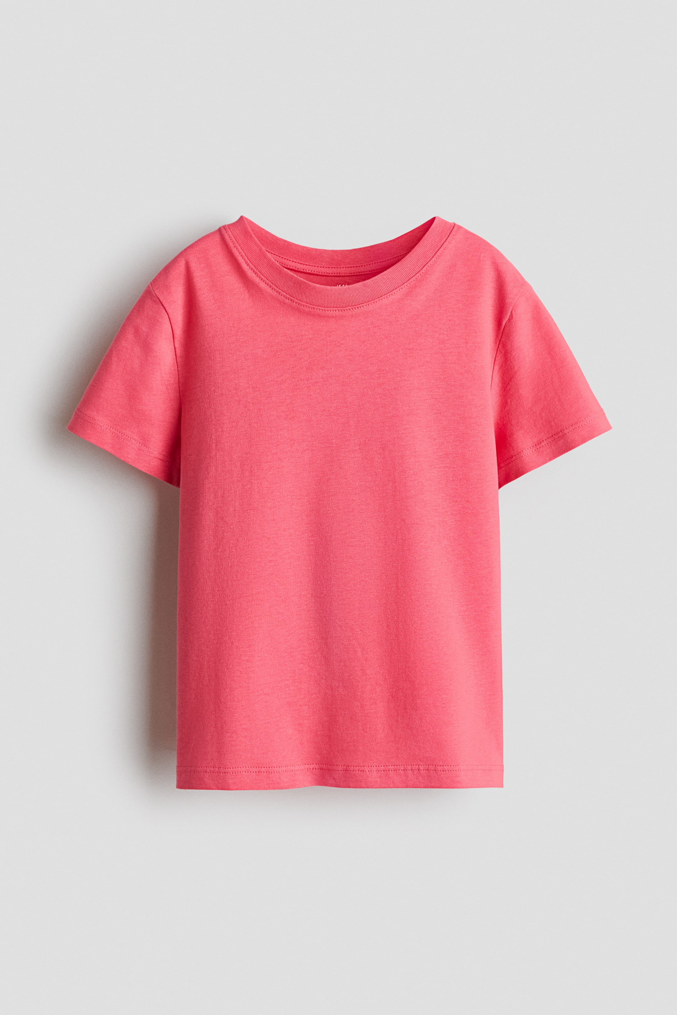 View larger image: T-shirt in soft cotton jersey. Featuring a pink colour, a round ribbed neckline, short sleeves, and a straight hem.