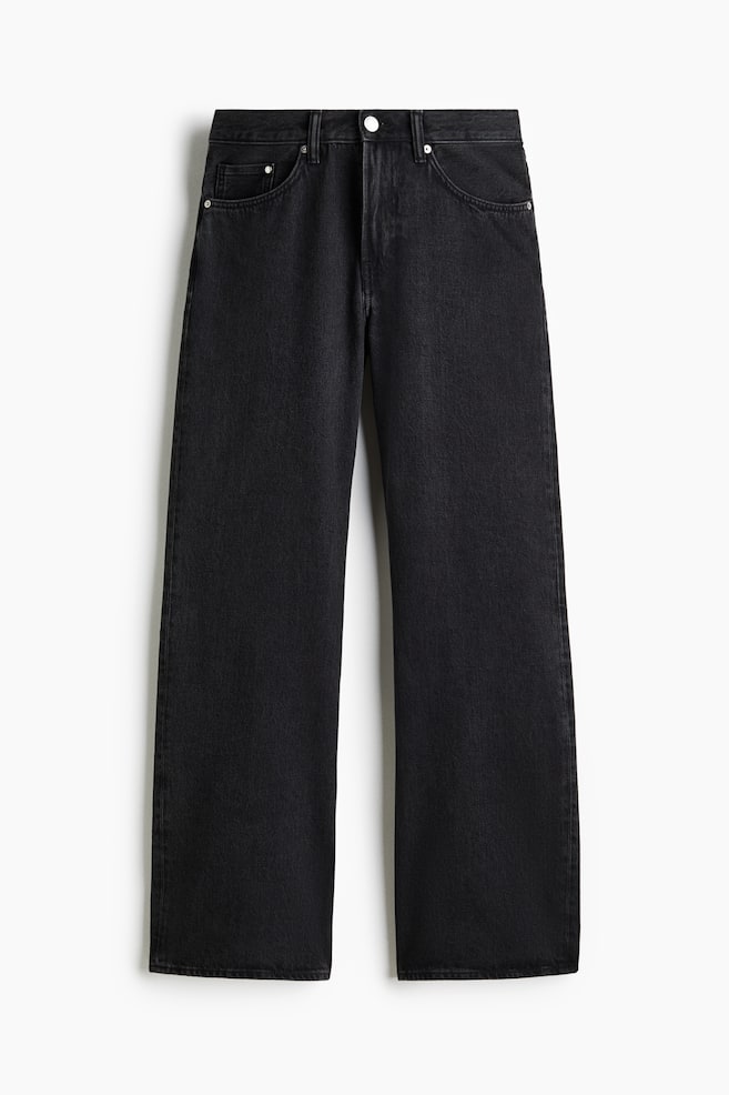 A pair of black denim jeans is displayed front-facing, featuring a button and zipper fly with a silver-toned button. It is designed with two front slash pockets, a small coin pocket, and a straight-leg cut. - 1