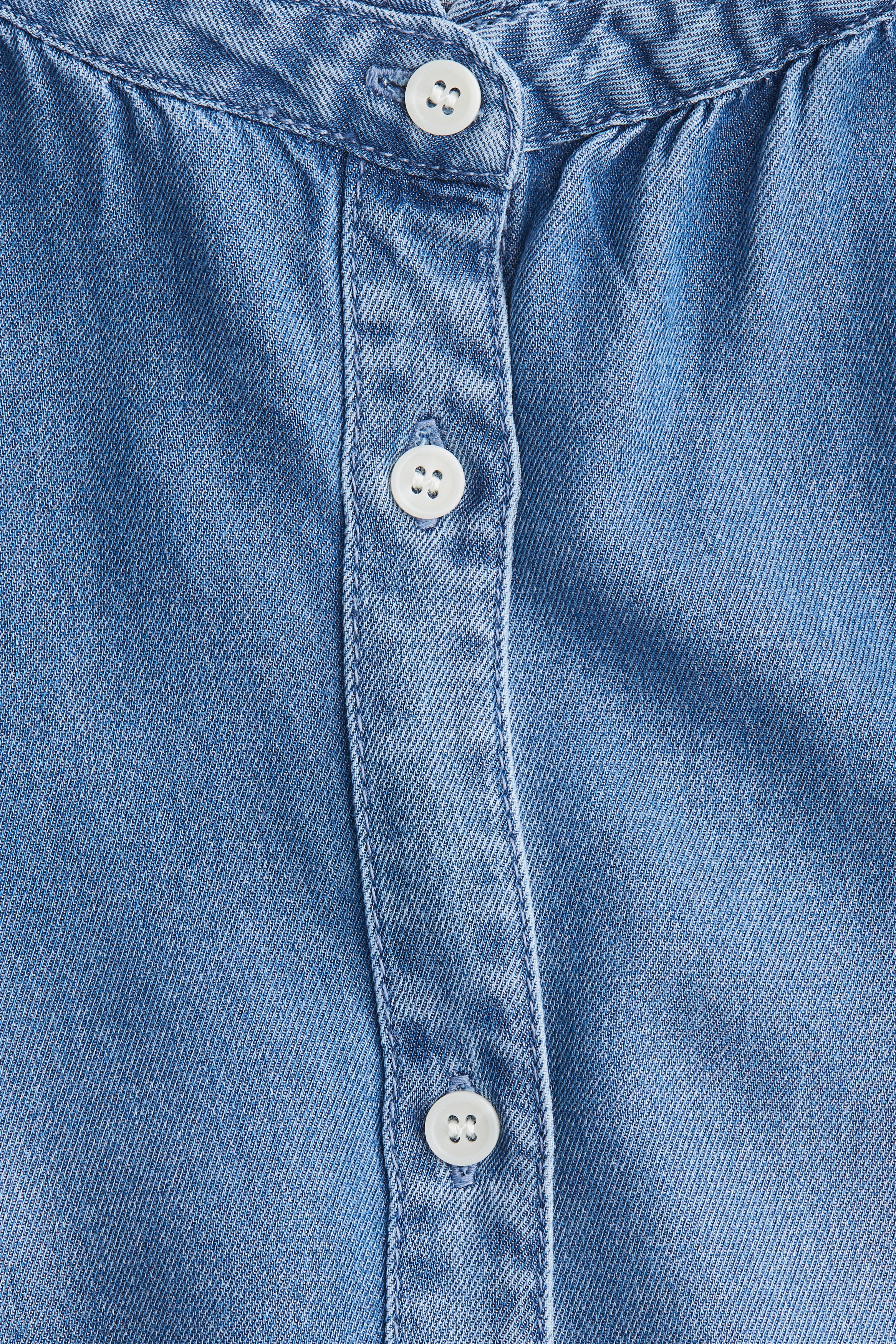 Frill-trimmed denim blouse