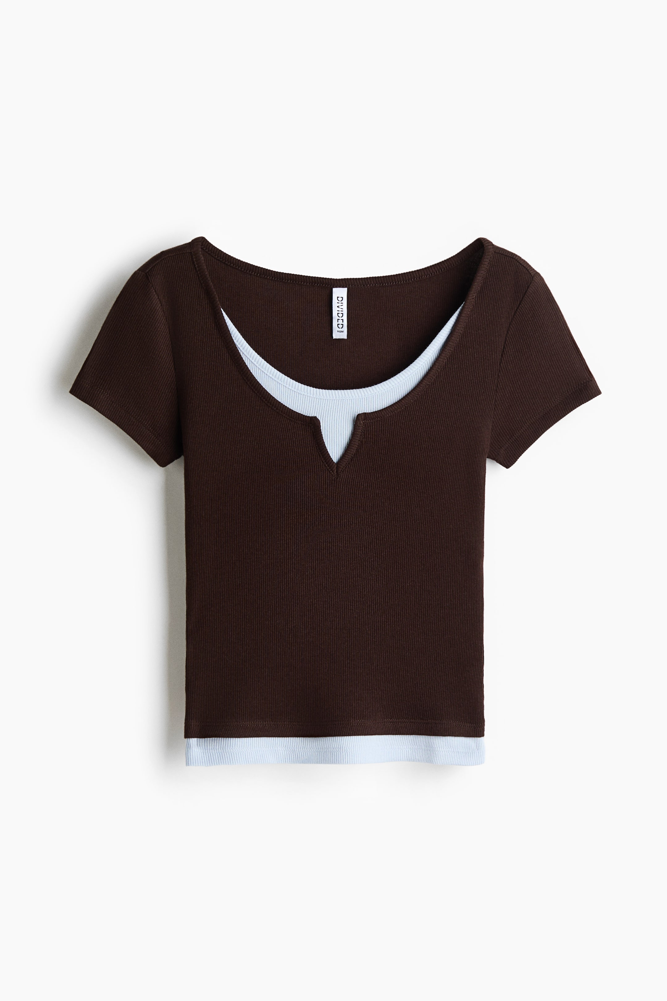 View larger image: A layered top is presenting a front view, featuring a brown ribbed short-sleeved outer layer with a scoop neck and V-notch. A light blue ribbed sleeveless inner layer is showing at the neckline and hem.
