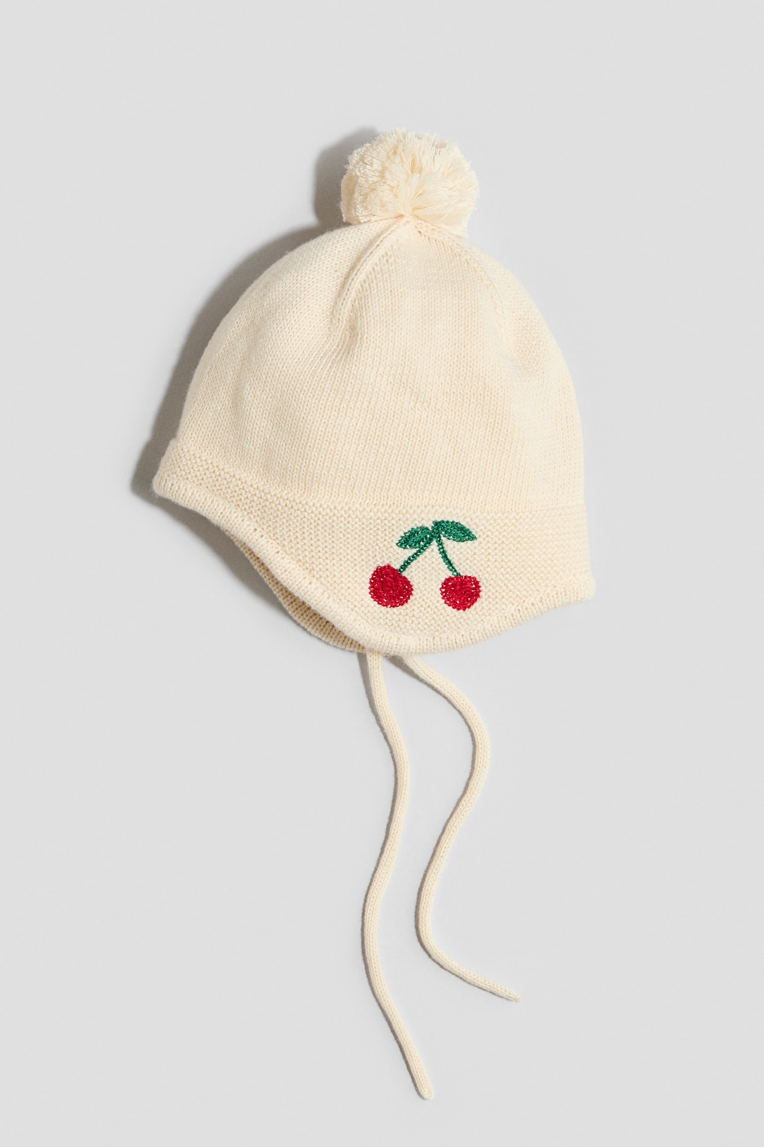 Embroidery-detail earflap beanie - Cream/Cherries
