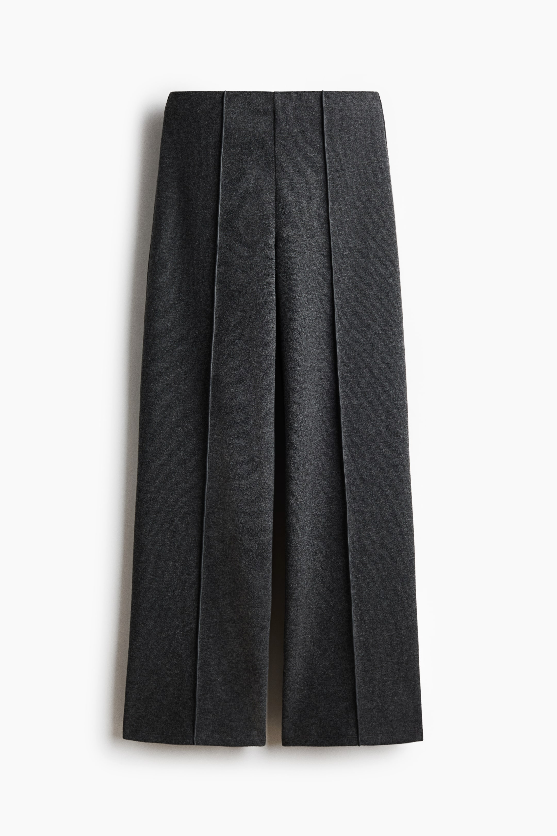 View larger image: Dark grey culottes are shown from the front, featuring wide legs with permanent pressed creases running down the centre of each leg.