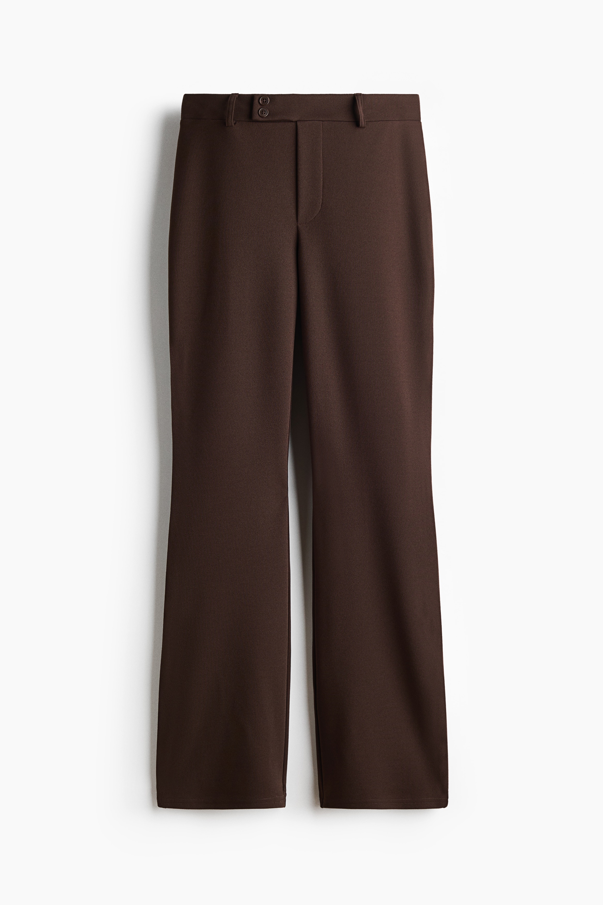These dark brown trousers are shown from the front, highlighting a structured wide-leg silhouette. They feature a flat-front waistband with belt loops, a concealed fly, and an offset double-button closure.