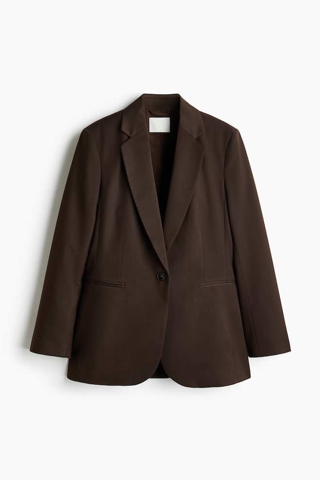 A dark brown blazer is displaying its front, featuring wide notch lapels. It is designed with a single black button closure and two horizontal welt pockets. - 1