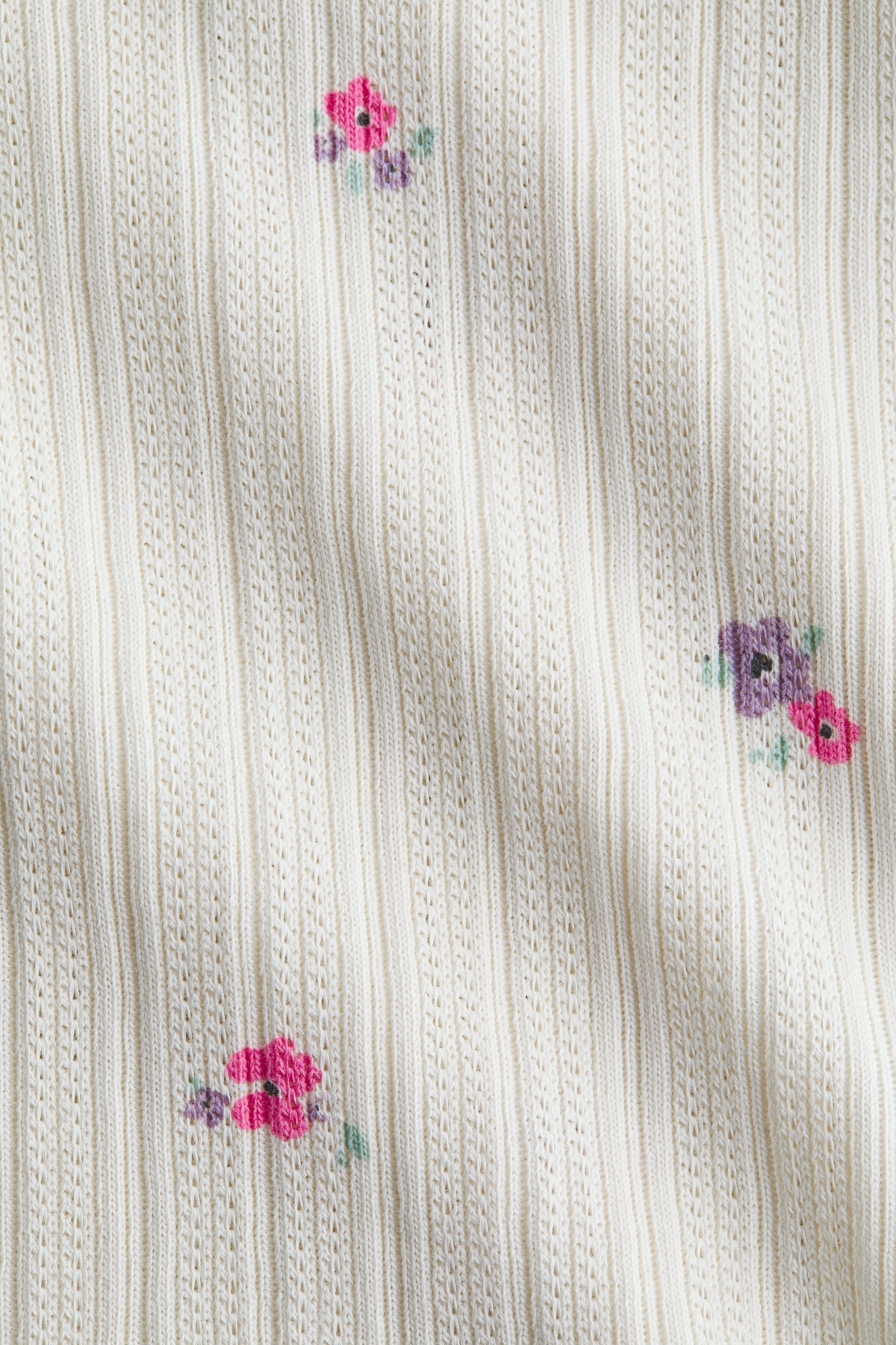 Ampliar la imagen: Top sin mangas en pointelle con olanes - Crema/Floreado - Kids | H&M MX 2