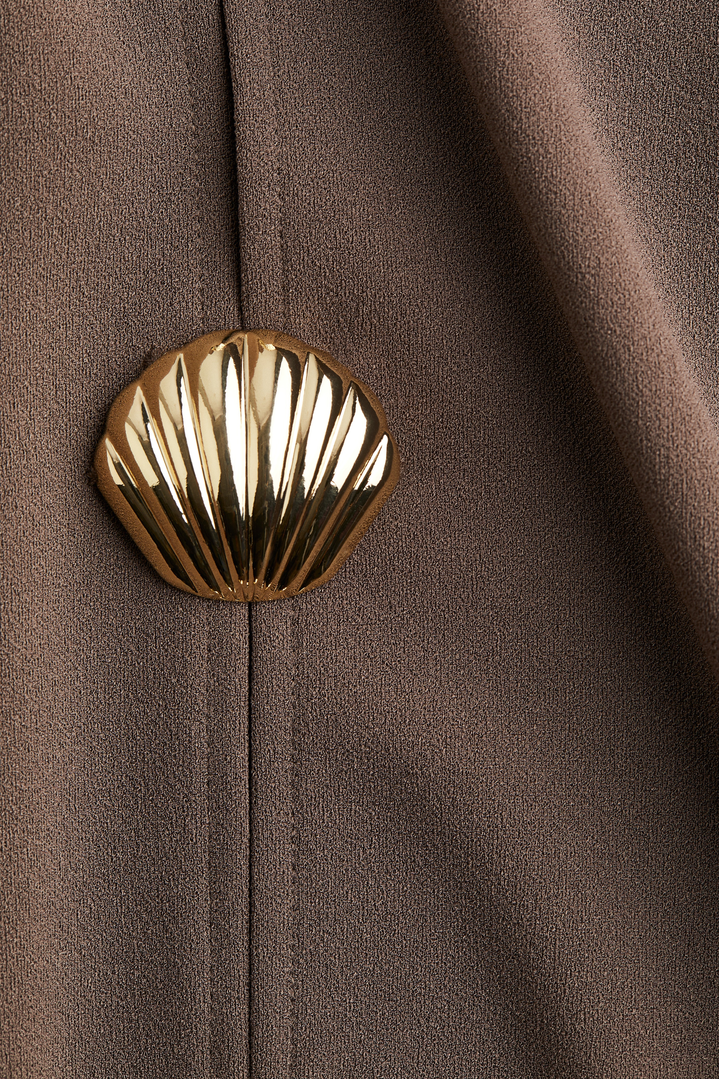 Button-decorated top