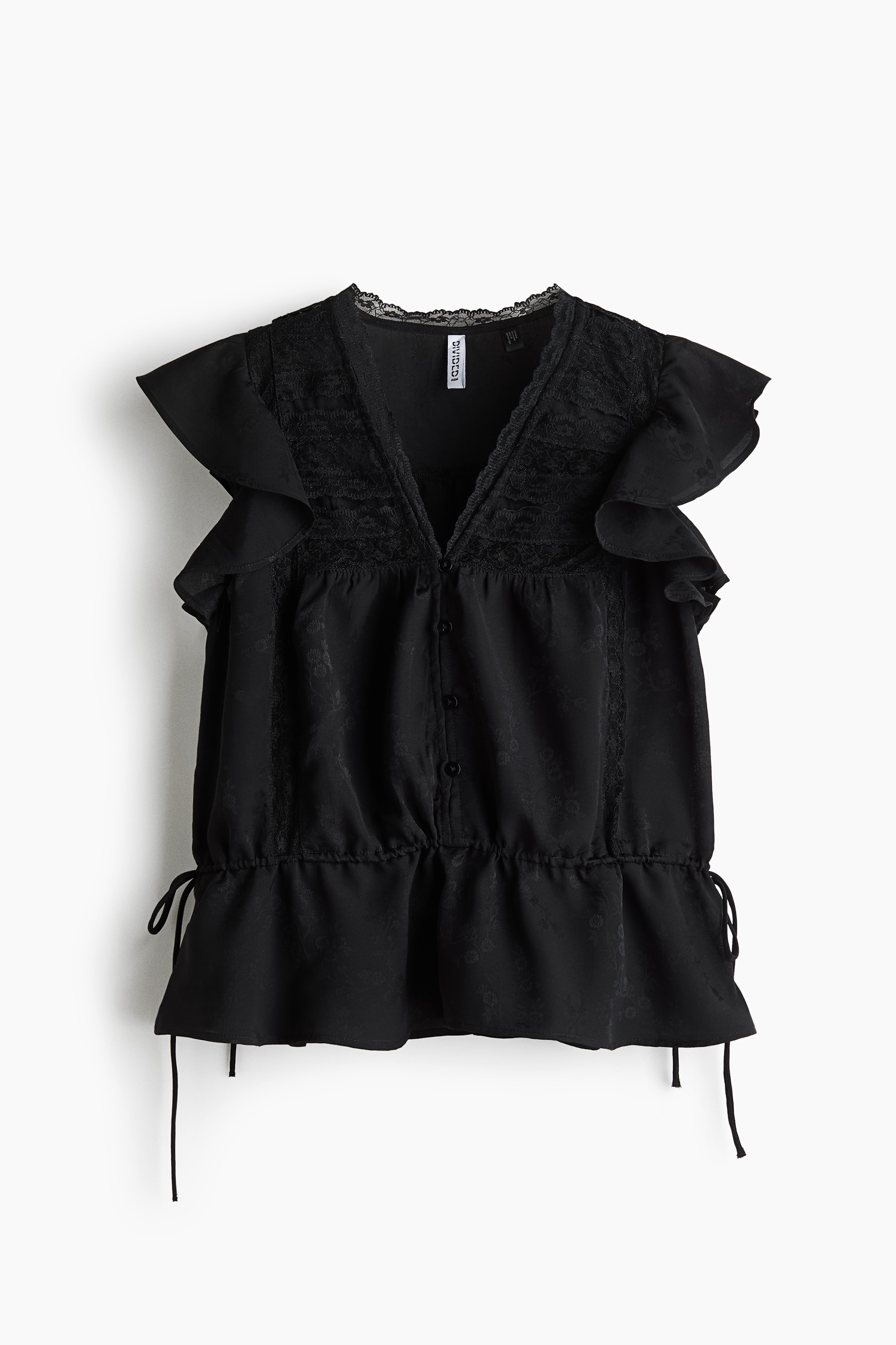 A black blouse featuring a lace-trimmed V-neckline, front buttons, and flutter sleeves is being worn by the model. The sheer-weave garment is detailed with lace insets across the upper chest and a gathered waist with a narrow drawstring.