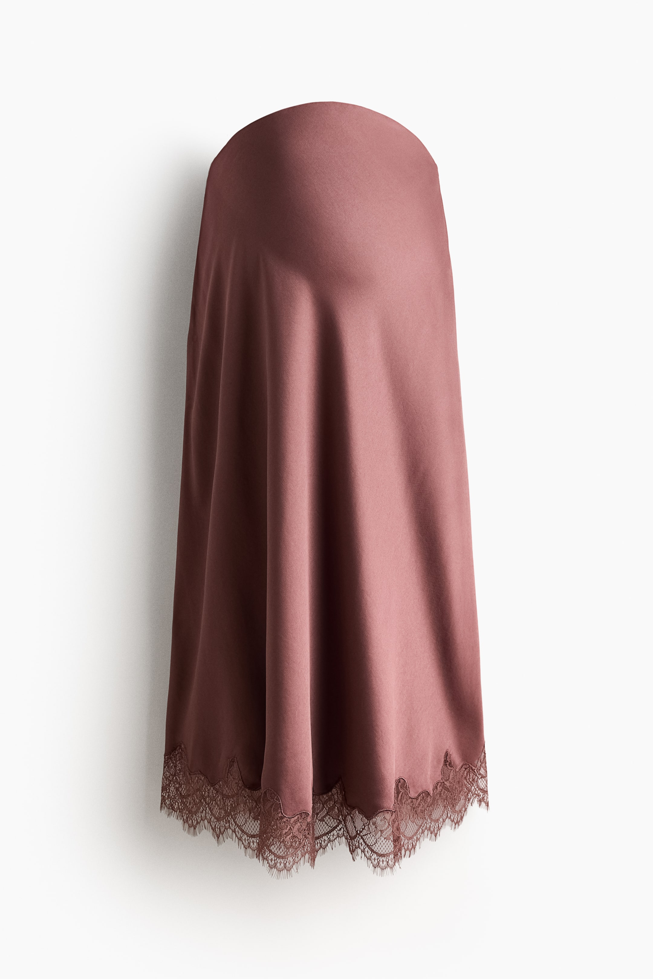 View larger image: The calf-length skirt drapes softly in mauve satin. It features a high waist, and its straight-cut hem is finished with a scalloped lace trim.