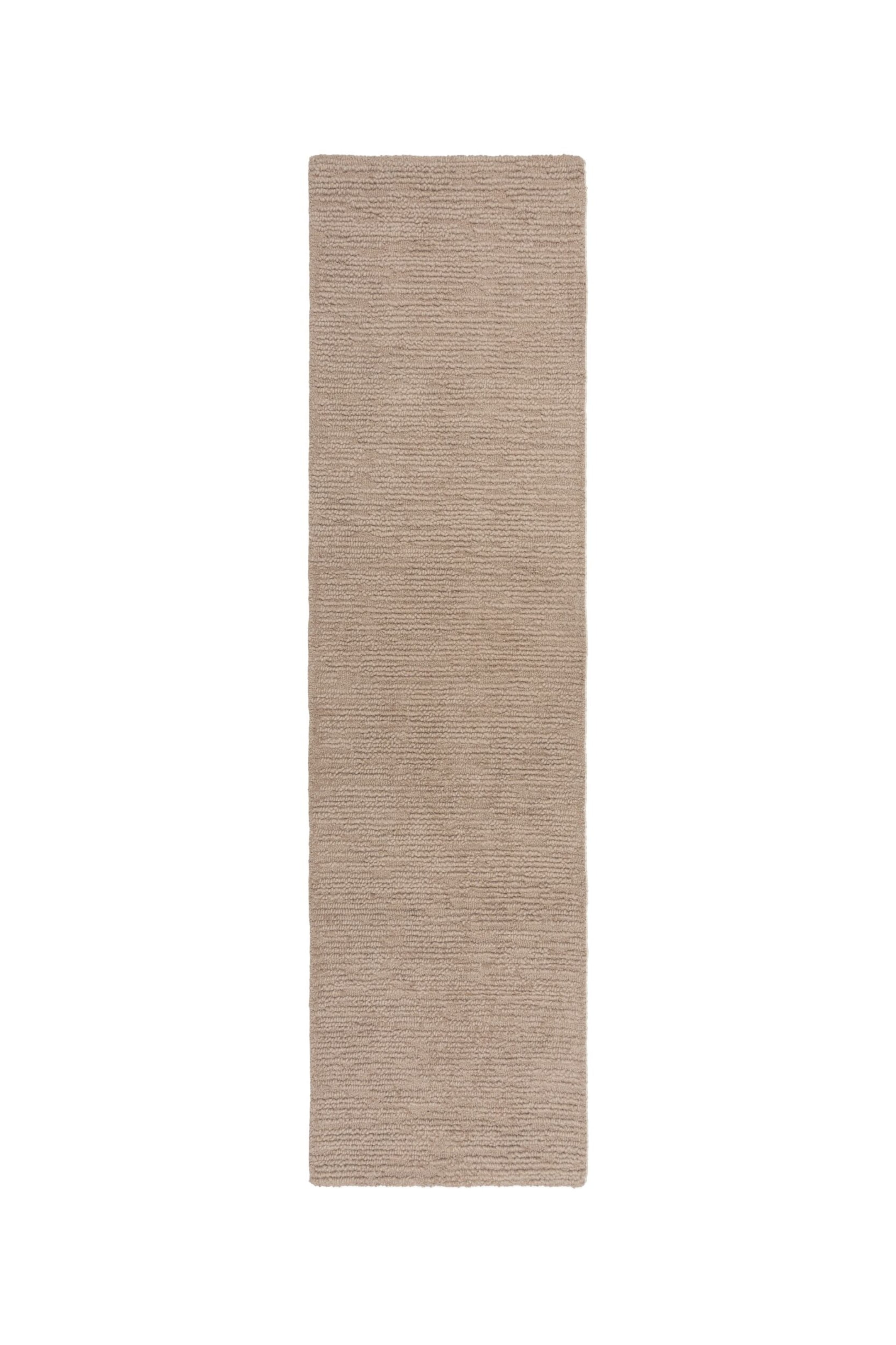 Visa större bild: En beige löparematta ligger plant och har en distinkt horisontell ribbad struktur över hela ytan.