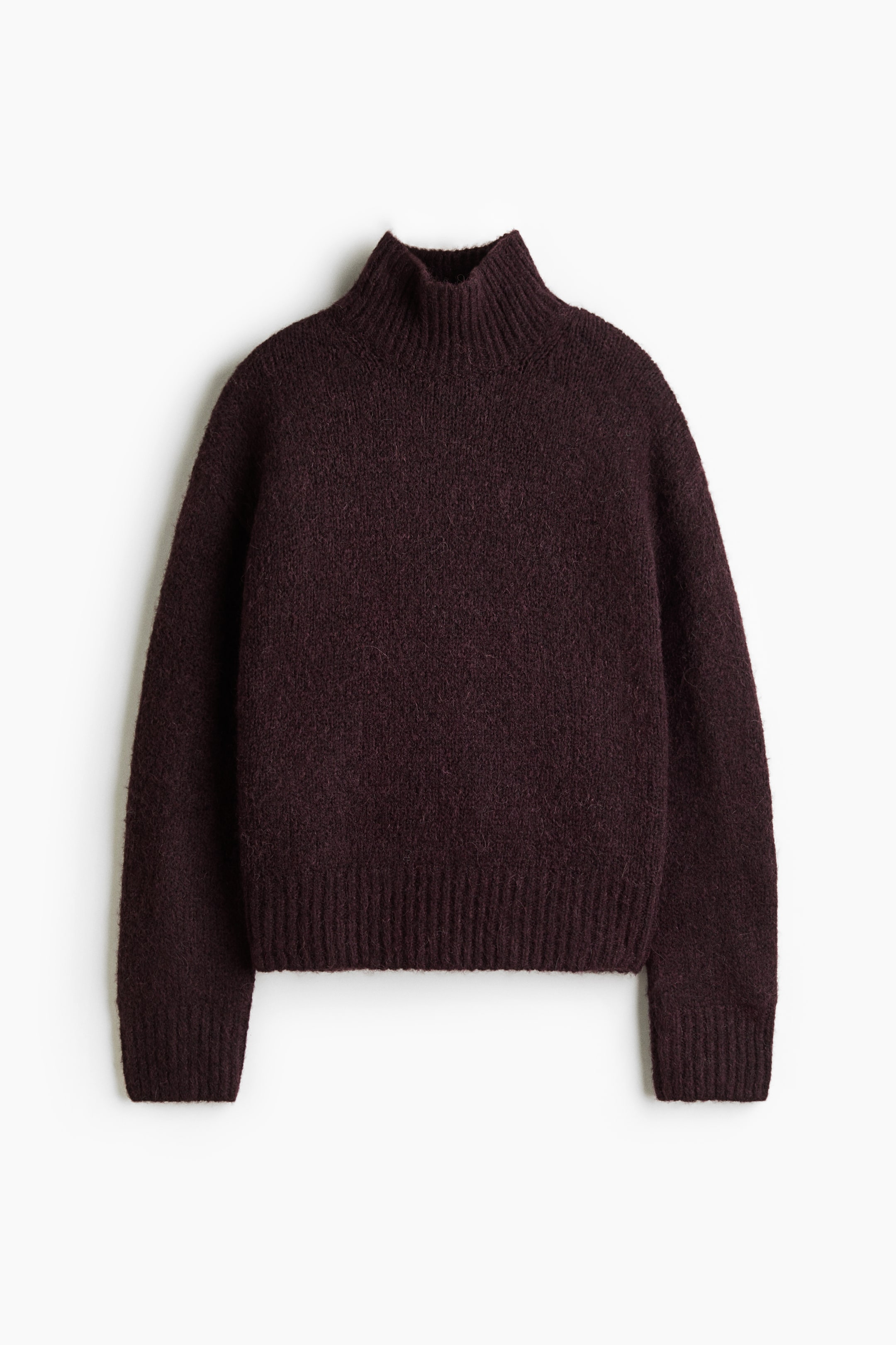 View larger image: A dark plum knit sweater is shown from the front, featuring a fuzzy, textured knit fabric with a ribbed mock neck, long sleeves with ribbed cuffs, and a ribbed hem.