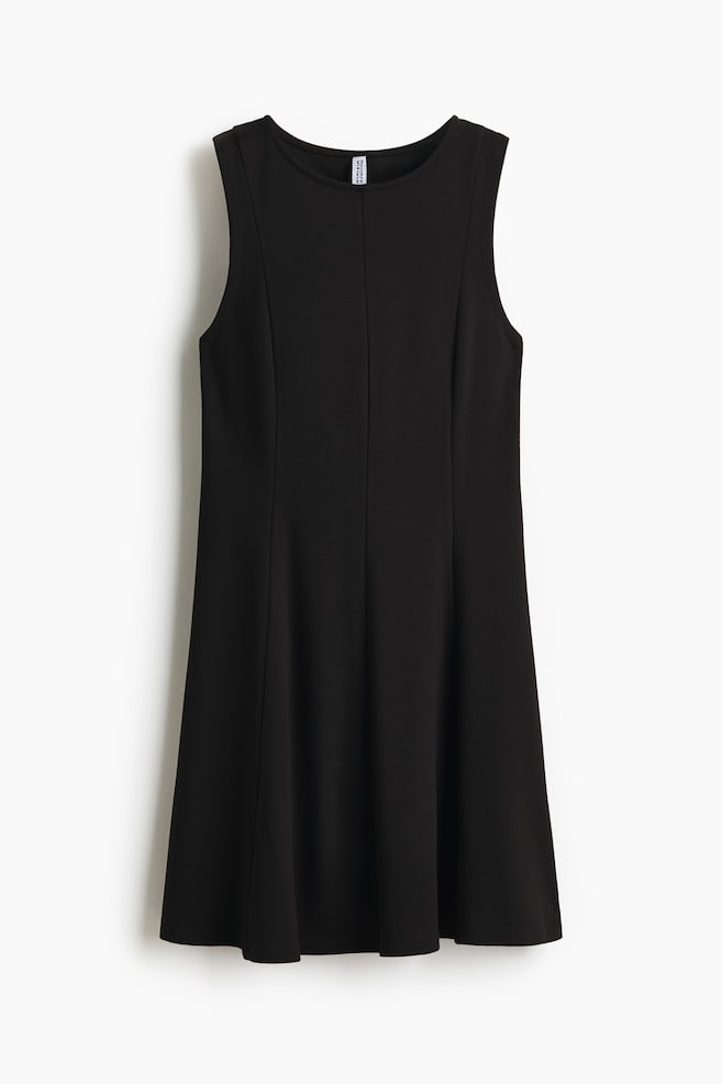 A black sleeveless dress is facing FRONT, featuring a round neckline, vertical seams on the front bodice, and a subtly flared skirt. - 1