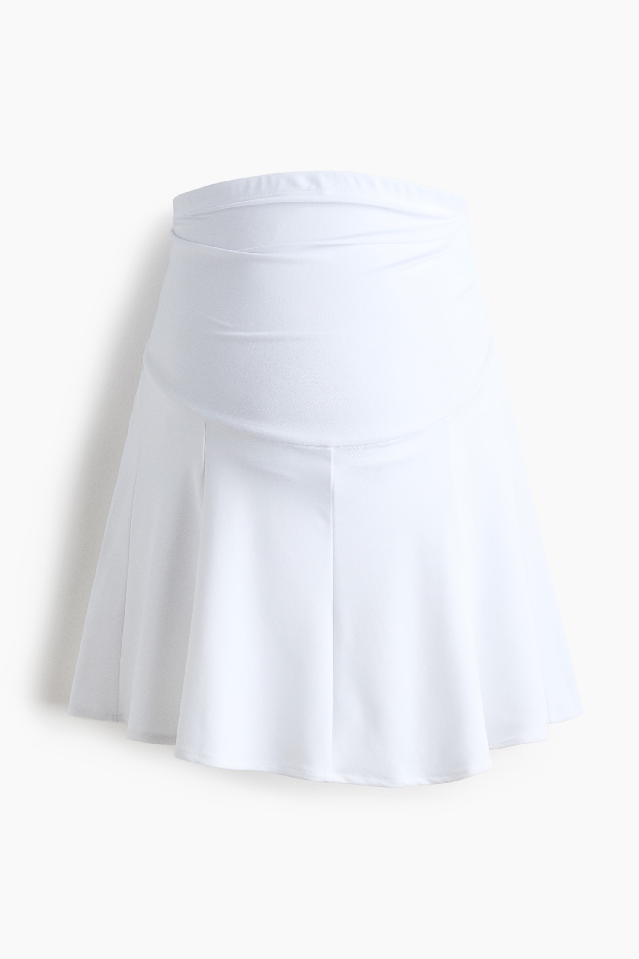 Προβολή μεγαλύτερης εικόνας: Μια λευκή φούστα σε γραμμή Α παρουσιάζεται από μπροστά, με φαρδιά, ψηλόμεση ζώνη που διαθέτει διακριτικές πτυχώσεις και έντονες κάθετες ραφές στη φαρδιά φούστα.