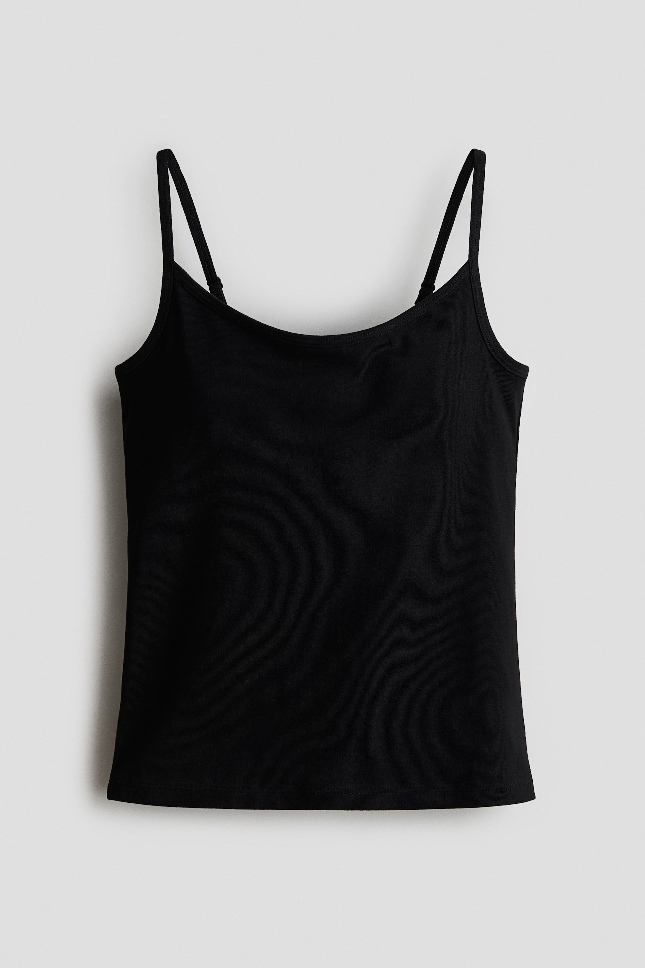 View larger image: A black camisole is showcased in a front view, featuring a scoop neckline and thin, adjustable spaghetti straps. It exhibits a smooth fabric texture and a straight bottom hem.