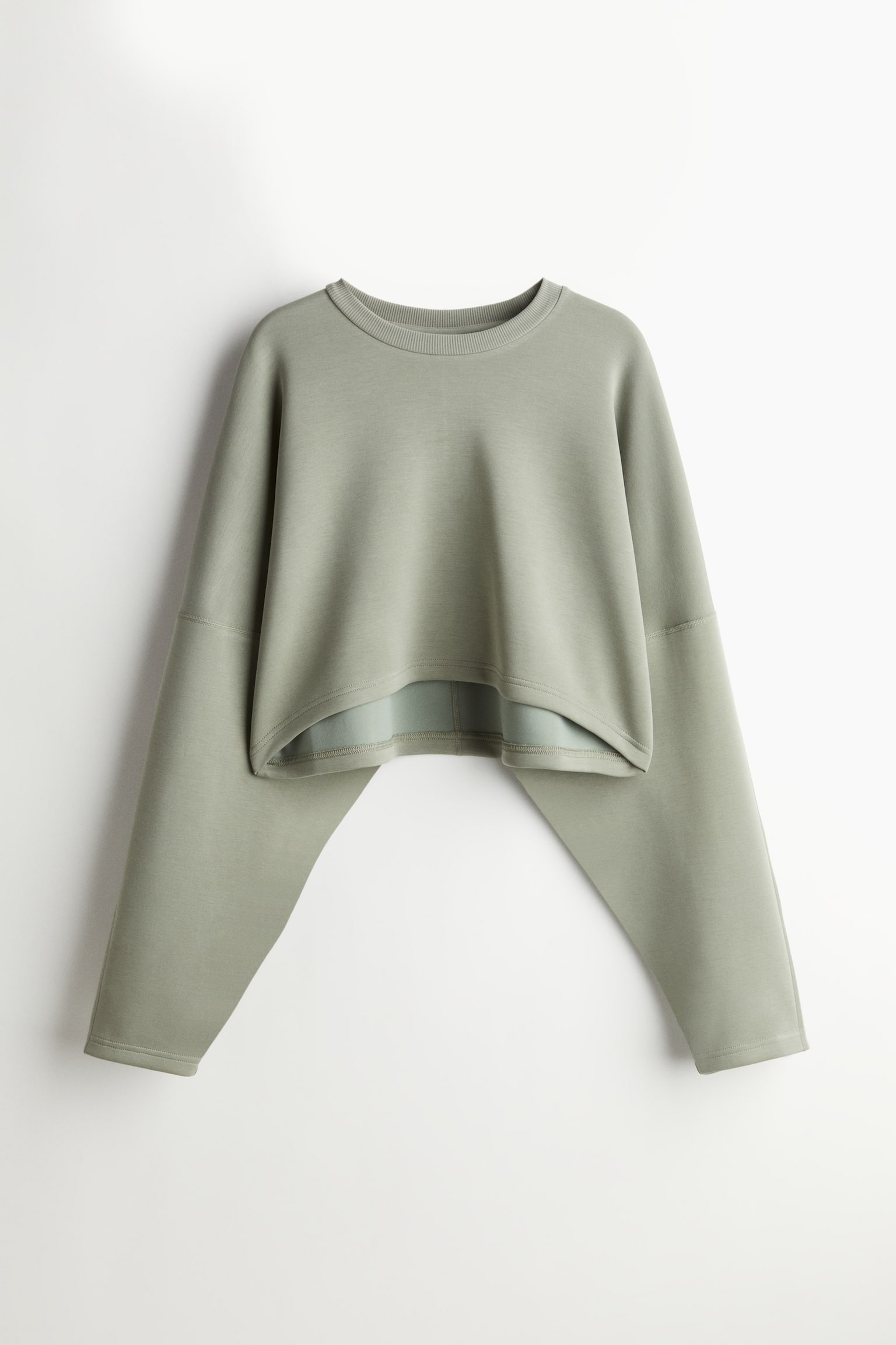 Cropped sports top in DryMove™ - Light khaki green - 1