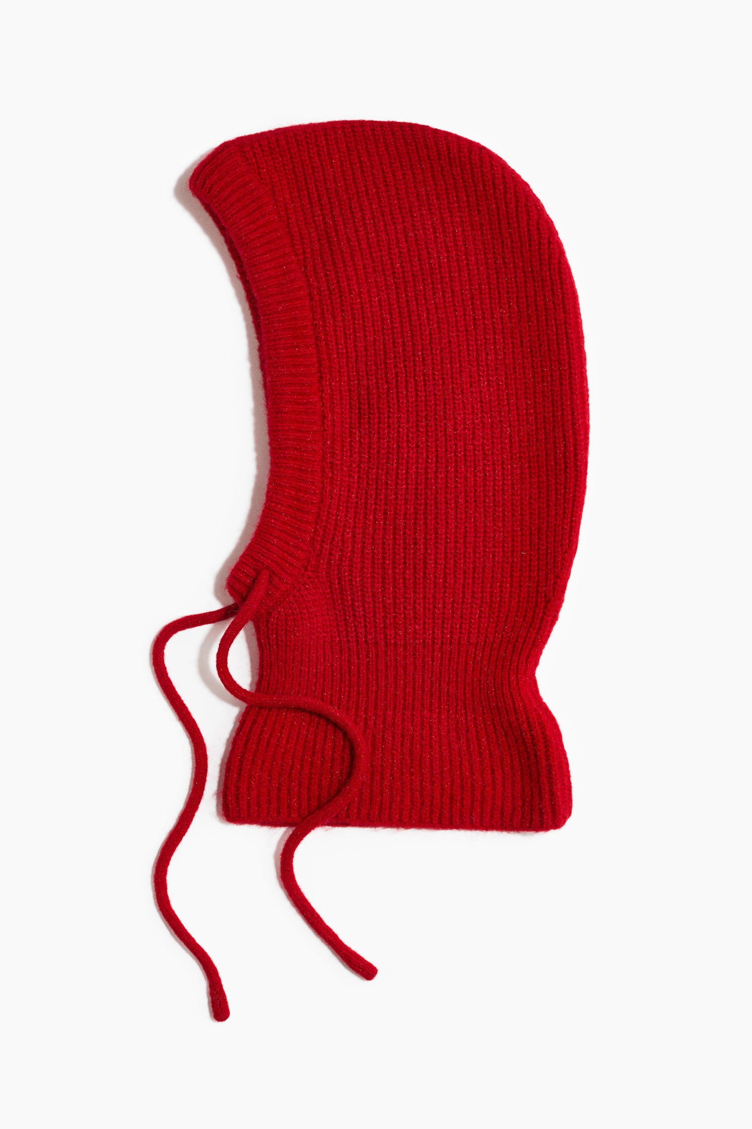 A red ribbed-knit balaclava is shown in profile, featuring a curved hood design with a ribbed trim around the face opening. The hood extends down to cover the neck and includes two matching red knit drawstrings hanging from the chin area.