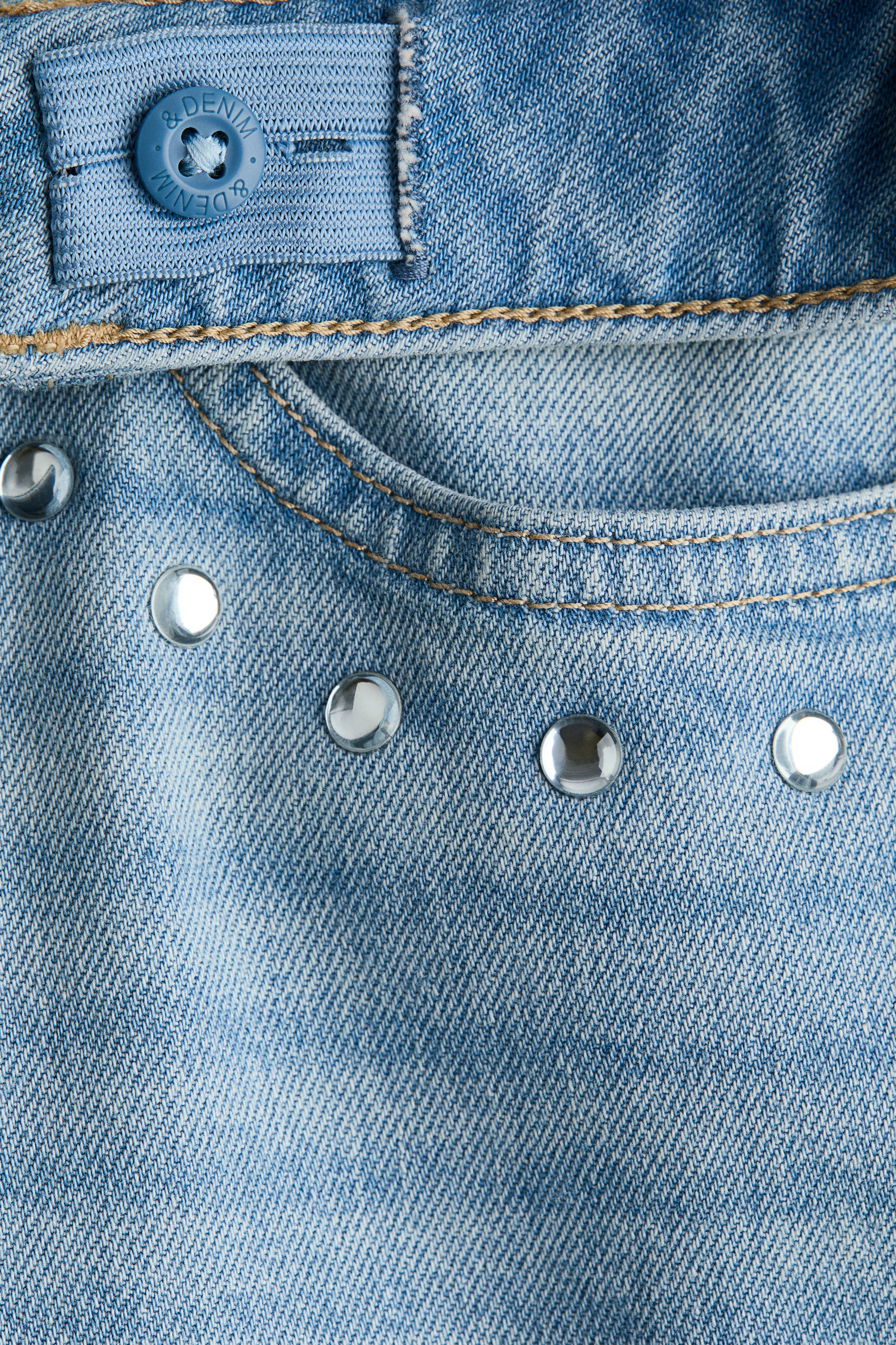 Jean riveté taille basse jambes larges
