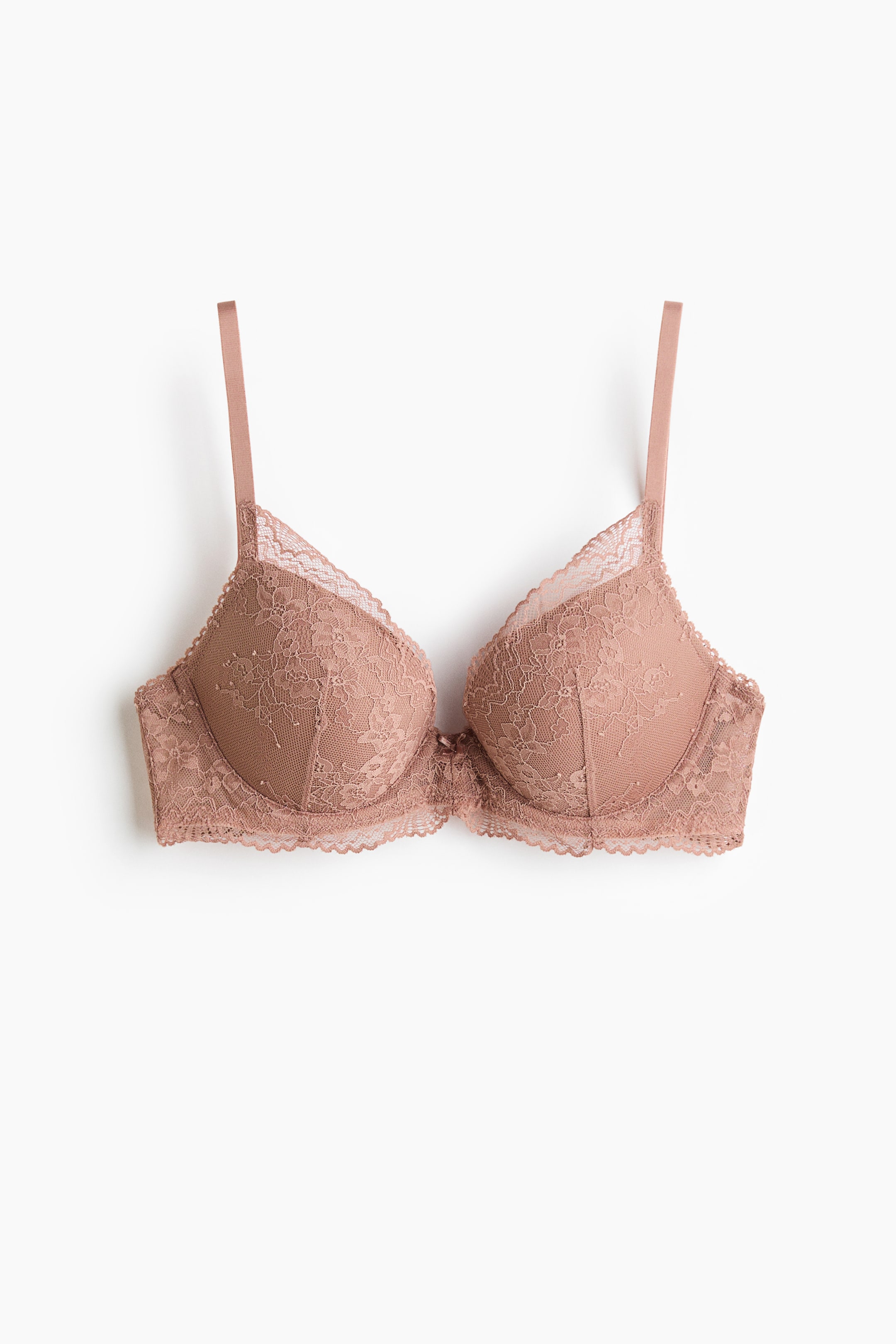 View larger image: "This push-up bra showcases a front view, adorned with lace-covered, underwired, and padded cups. It features a scalloped trim along the edges and comes with adjustable shoulder straps."