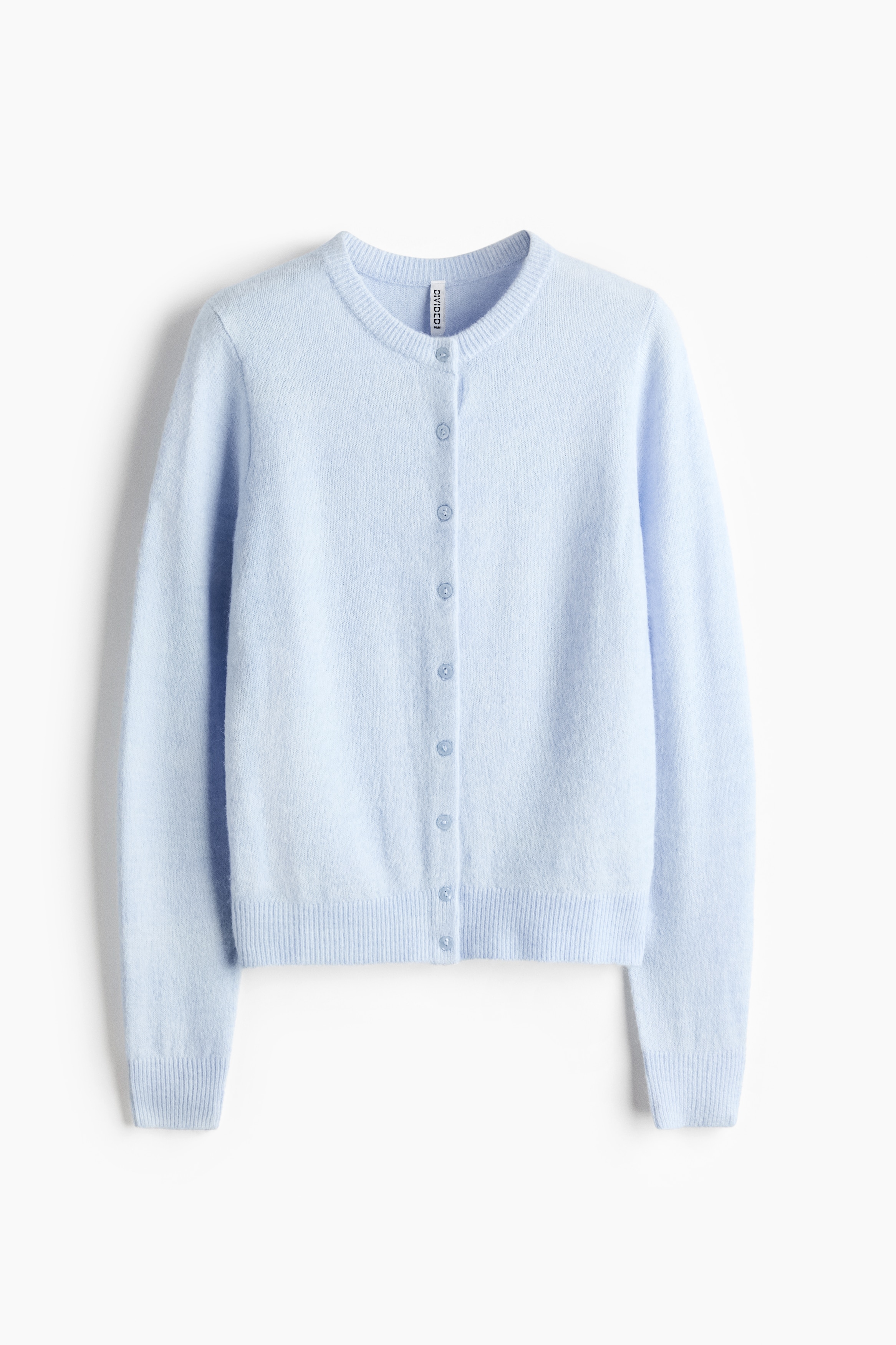 A light blue, fitted knit cardigan is being worn by the model with arms crossed. The cardigan features a round, rib-trimmed neckline, front buttons, and ribbed cuffs and hem, styled with a black skirt and a black belt with a silver buckle.