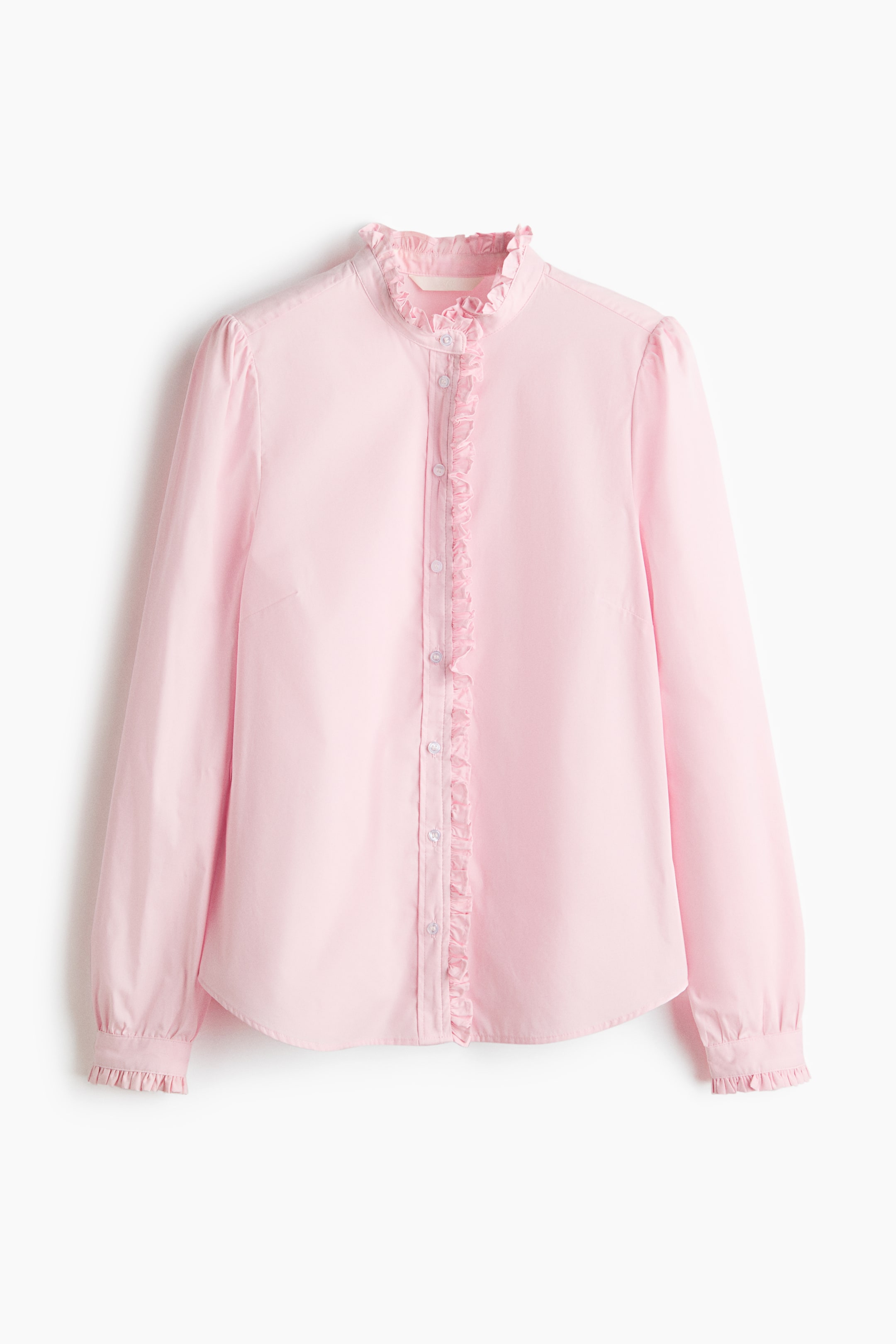 View larger image: A pink fitted blouse in crisp poplin is presenting its FRONT, featuring a band collar with a frill trim that is continuing down the button band. It is displaying long sleeves with gathers at the shoulders and frill-trimmed cuffs with a slit and button.