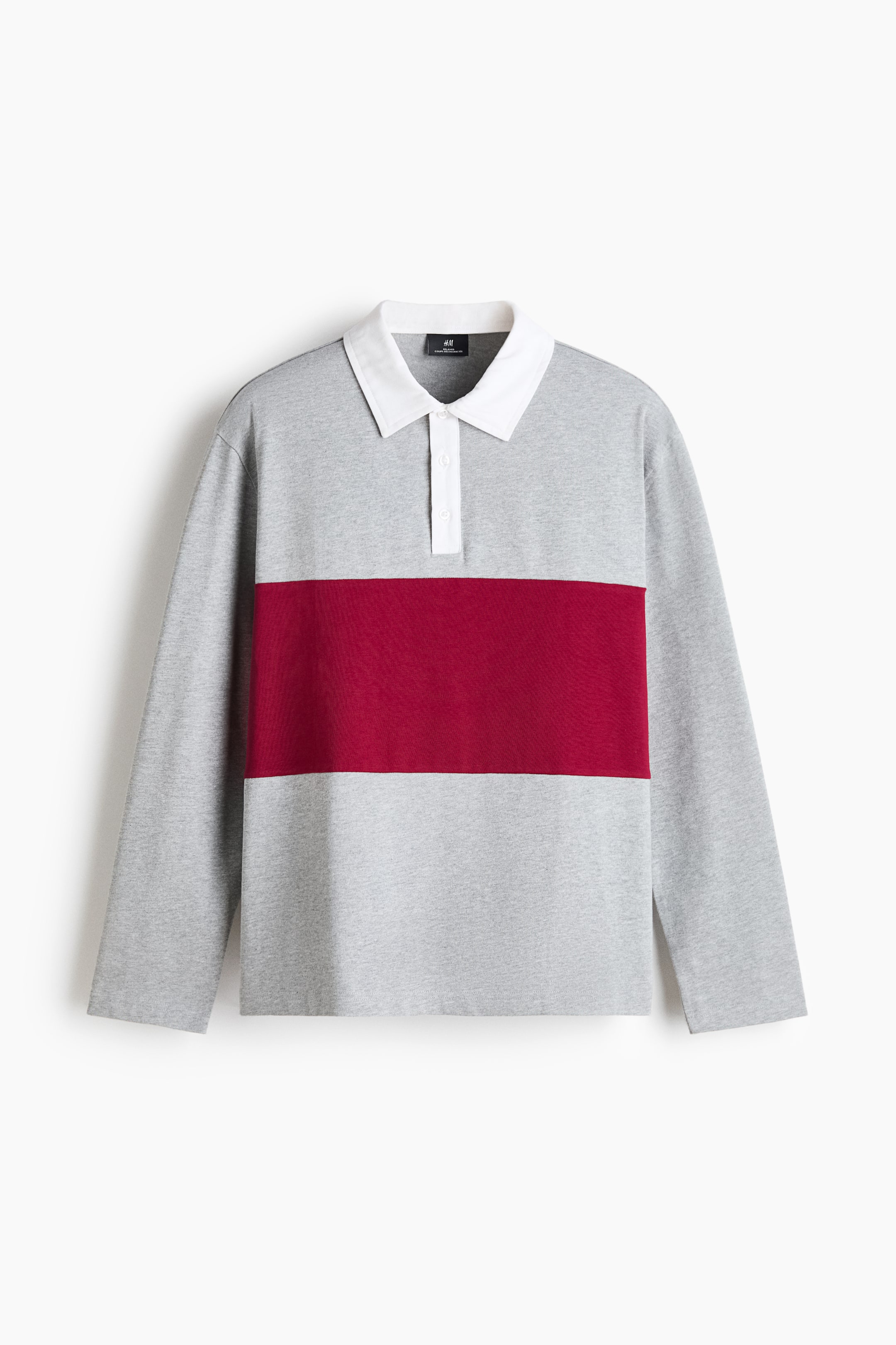 View larger image: A long-sleeved rugby shirt is shown front-facing, featuring a heather grey knit body with a wide, horizontal burgundy stripe across the chest. The shirt features a contrasting white pointed collar, a white partially buttoned placket, and straight-cut sleeves.