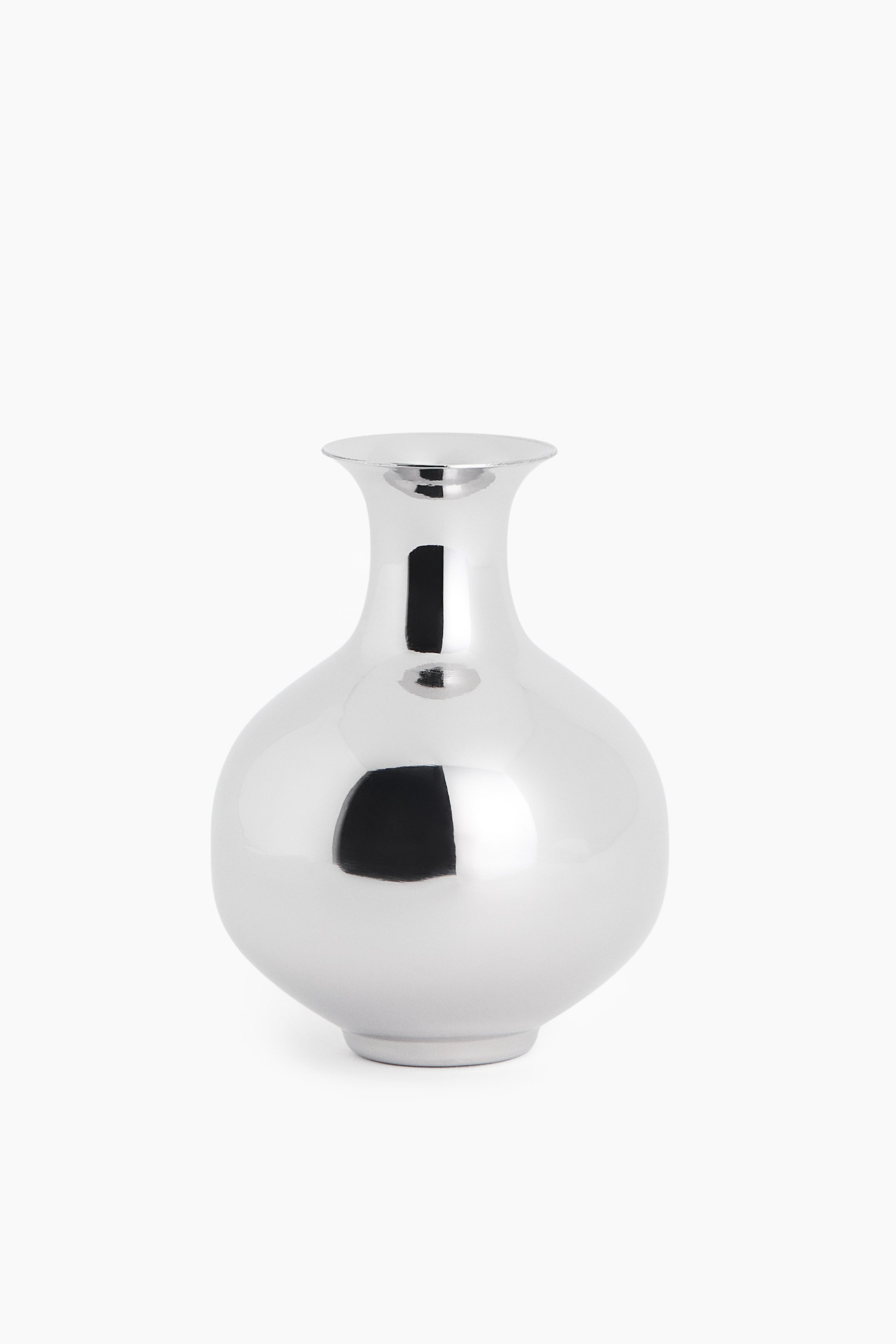 View larger image: A polished silver-toned metal vase is standing facing front, showcasing a bulbous body, a narrow neck, and a flared rim. The highly reflective, metallic surface is displaying dark, mirrored reflections across its curved shape.