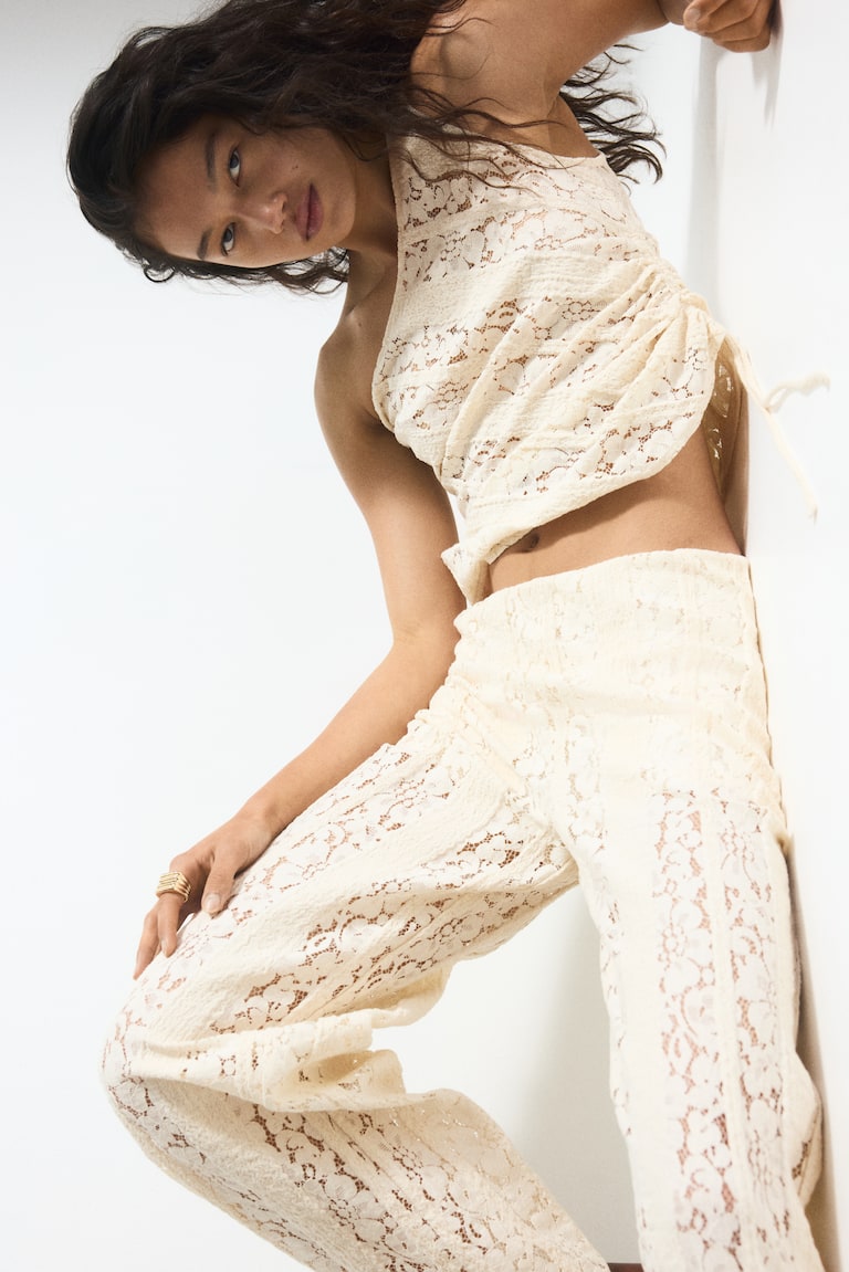 Pantaloni con dettagli in pizzo