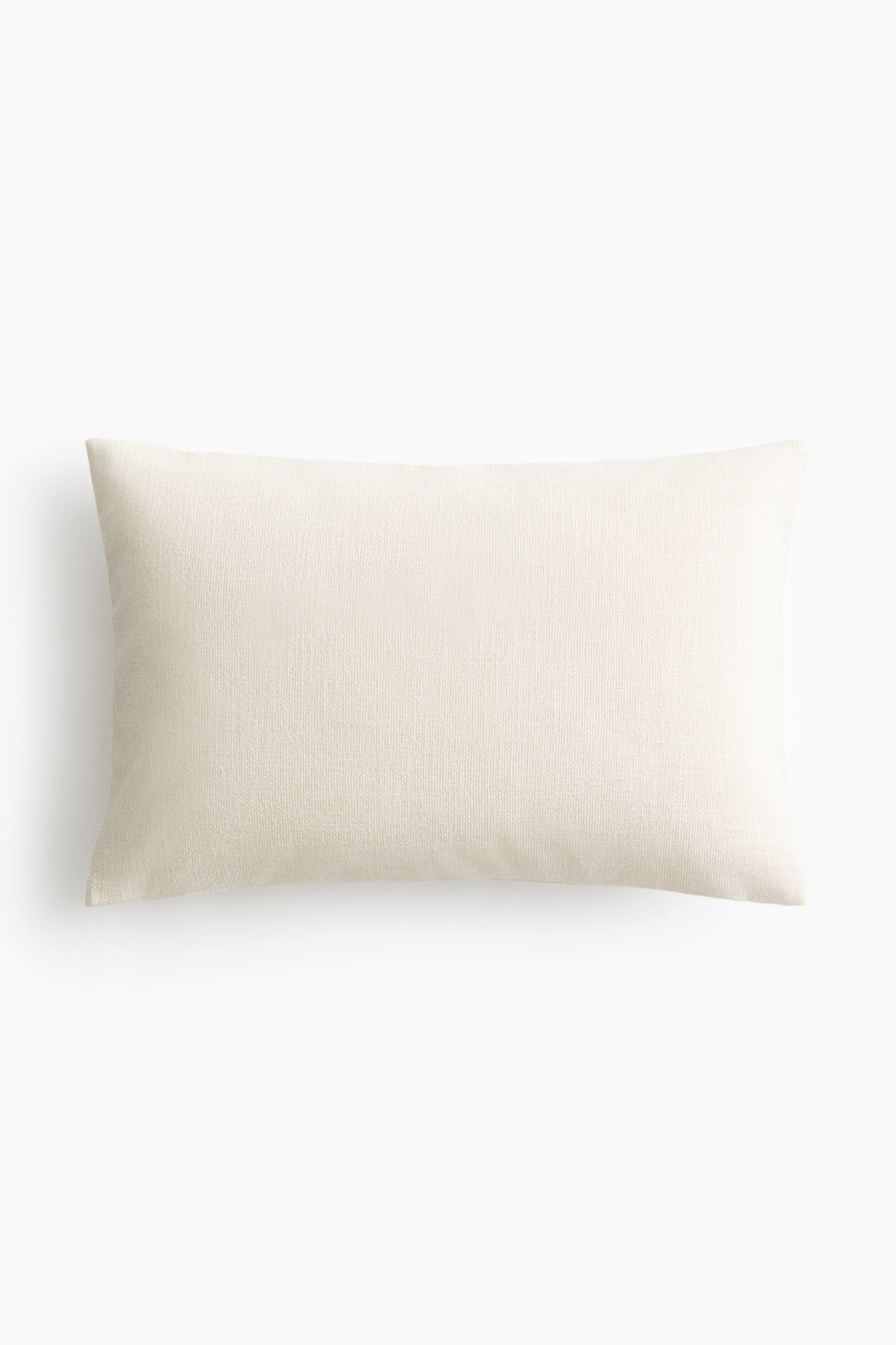 View larger image: A rectangular pillow is displaying its front side, featuring an off-white color and a subtly woven texture.