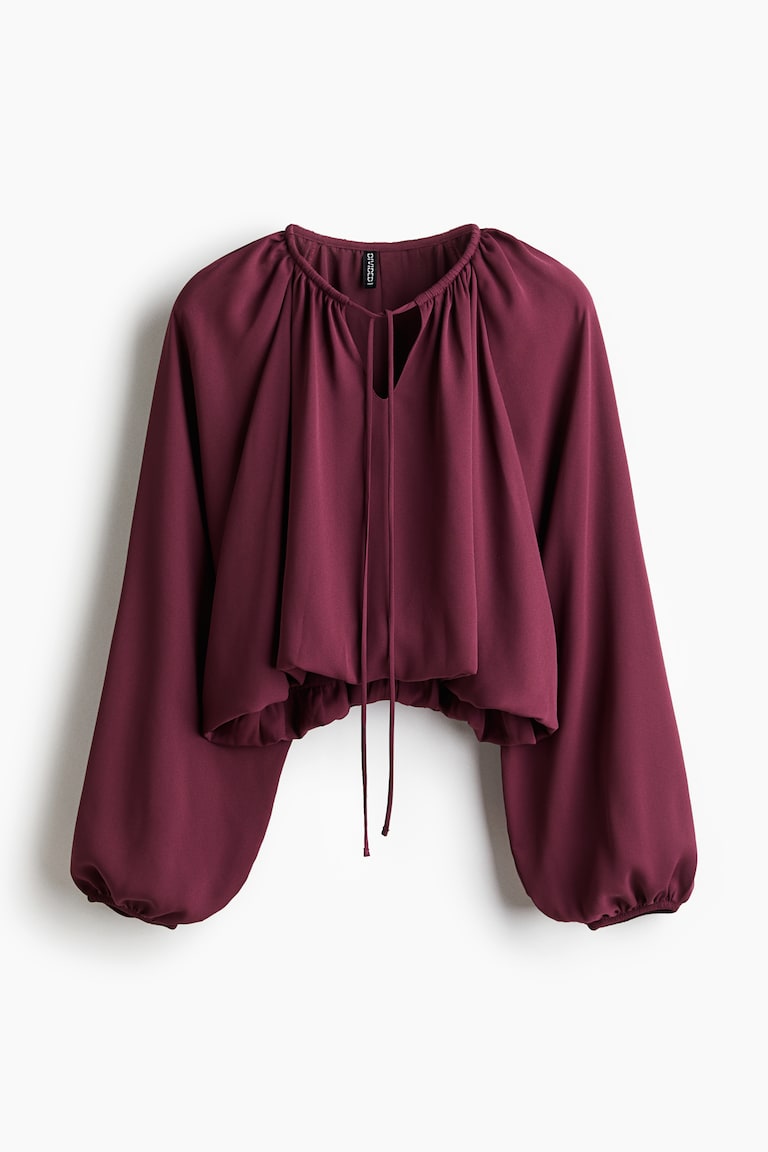 Bluza s donjim rubom balon kroja