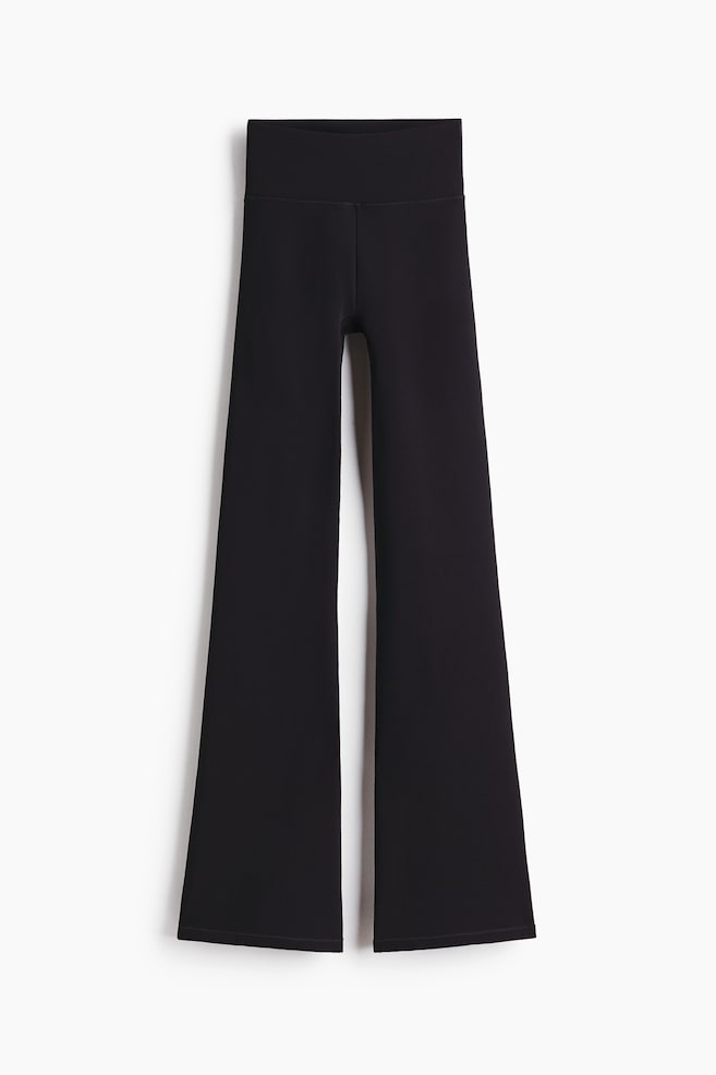 Warming Flared sports leggings with ThermoMove™ - Black/Warm brown - 1