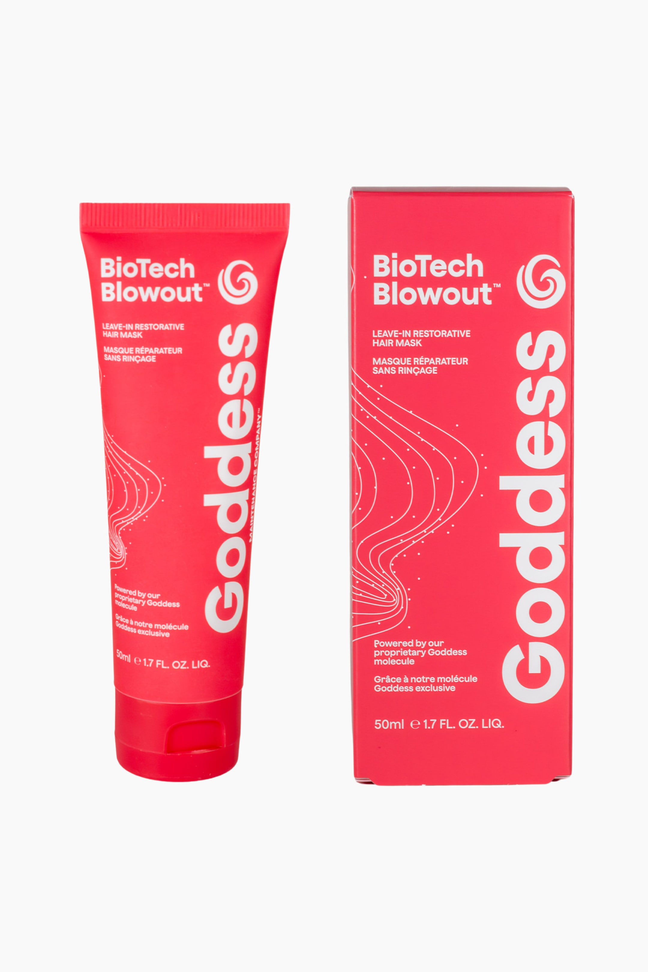 Visa större bild: En röd tub med hårmask och dess matchande röda kartong står upprätt. Tuben visar sin framsida, lätt vinklad åt vänster, medan kartongen är vänd framåt; båda har "BioTech Blowout?" och "Goddess" i vit text. Båda visar också "LEAVE-IN RESTORATIVE HAIR MASK" och ett vitt, virvlande linjemönster.