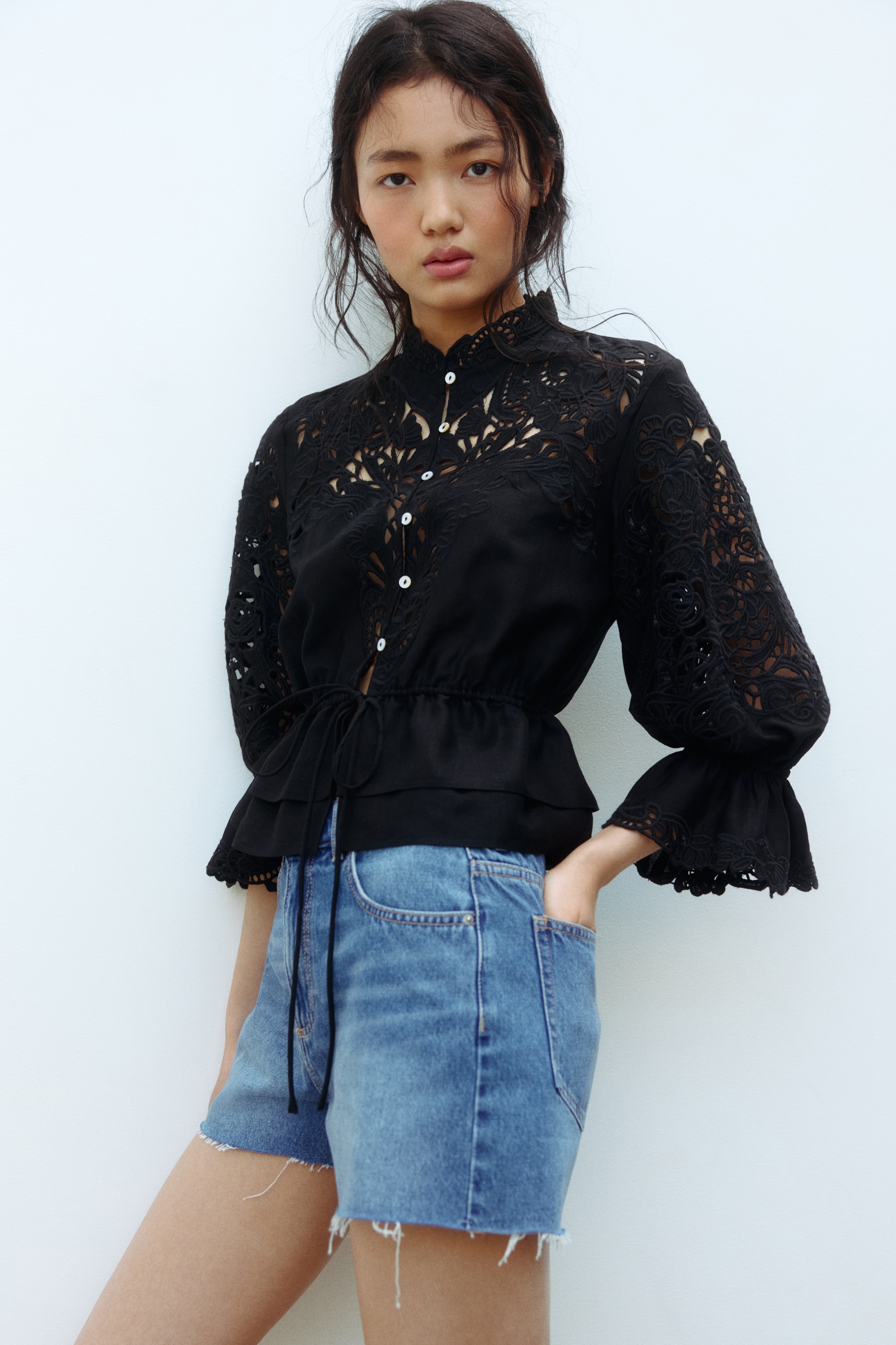 Raw-edge denim shorts
