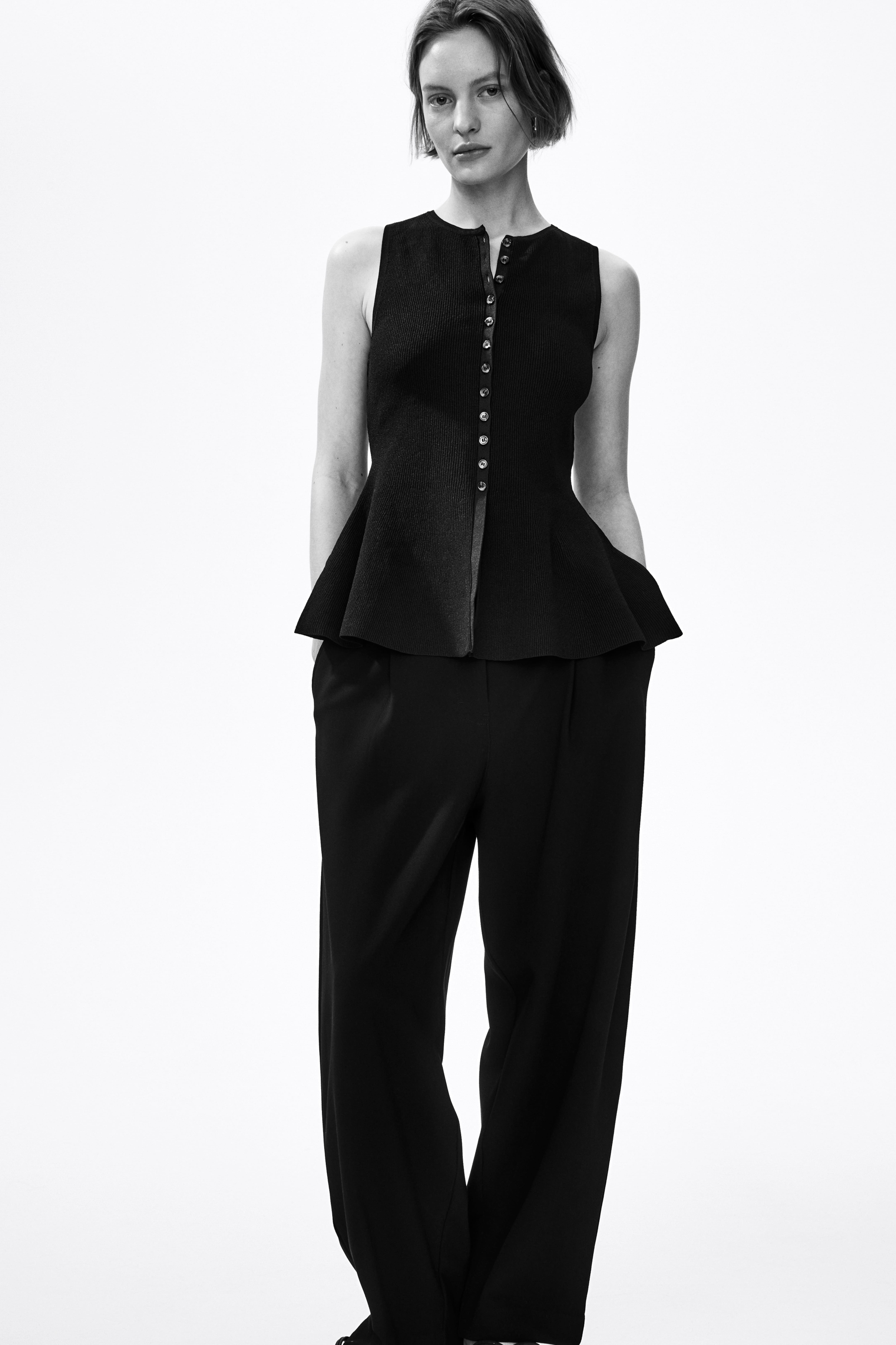 Rib-Knit Peplum Sleeveless Top