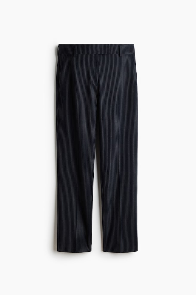 These dark navy pinstripe trousers are hanging flat in a front view, showcasing a straight-leg silhouette with thin vertical white stripes and pressed center creases. The design is featuring a structured waistband with belt loops and clean, tailored lines. - 1
