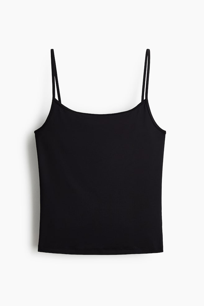 A black camisole is shown from the front. It features thin spaghetti straps, a straight neckline and a smooth, plain fabric. - 1