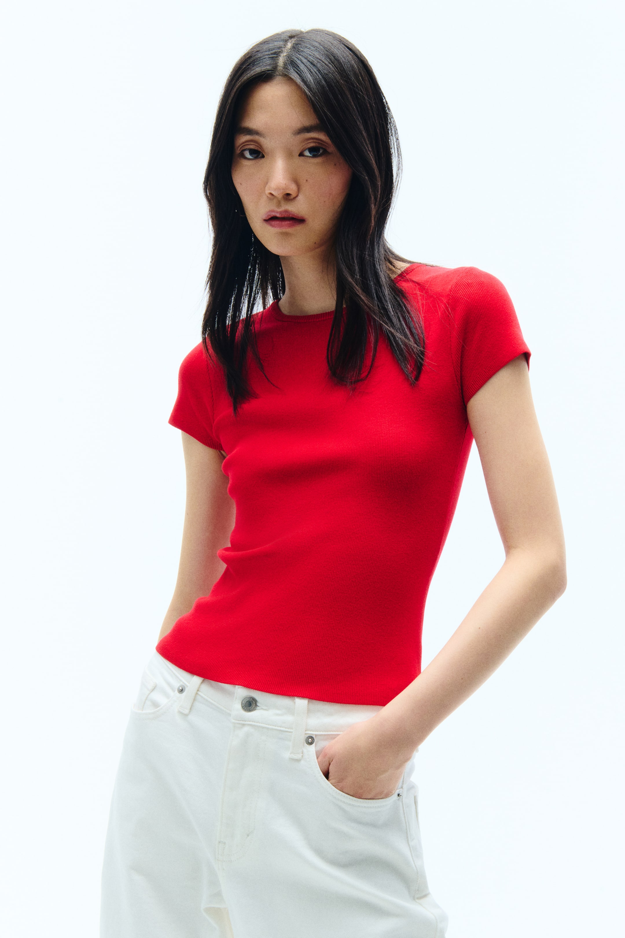 View larger image: A red ribbed knit top featuring a crew neck, a fitted silhouette, and short raglan sleeves.