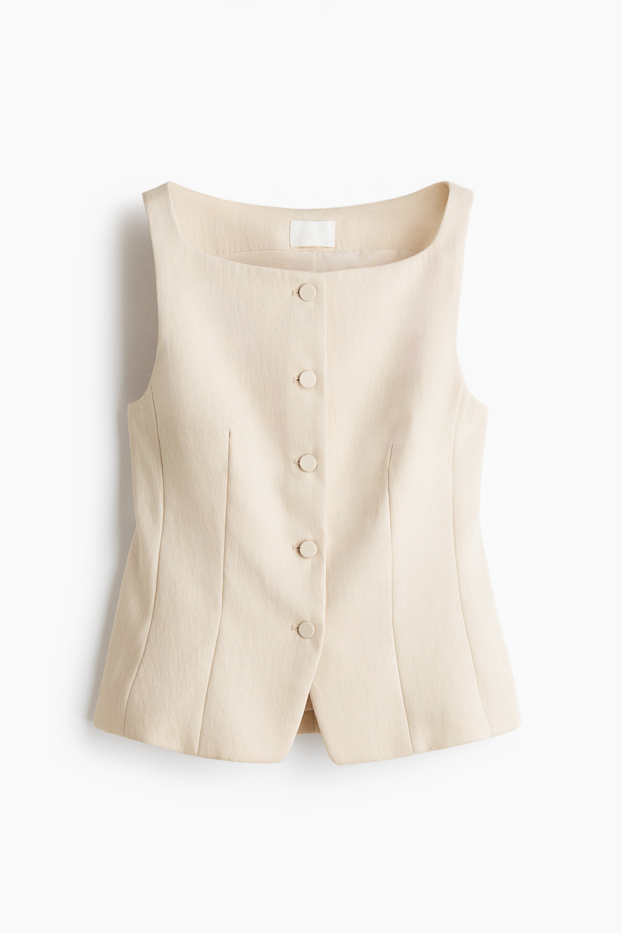 View larger image: From the FRONT view, a fitted waistcoat in light beige woven fabric showcases a square neckline, broad shoulder straps, five matching buttons down the center front, and shaping seams at the front that create a tailored appearance.