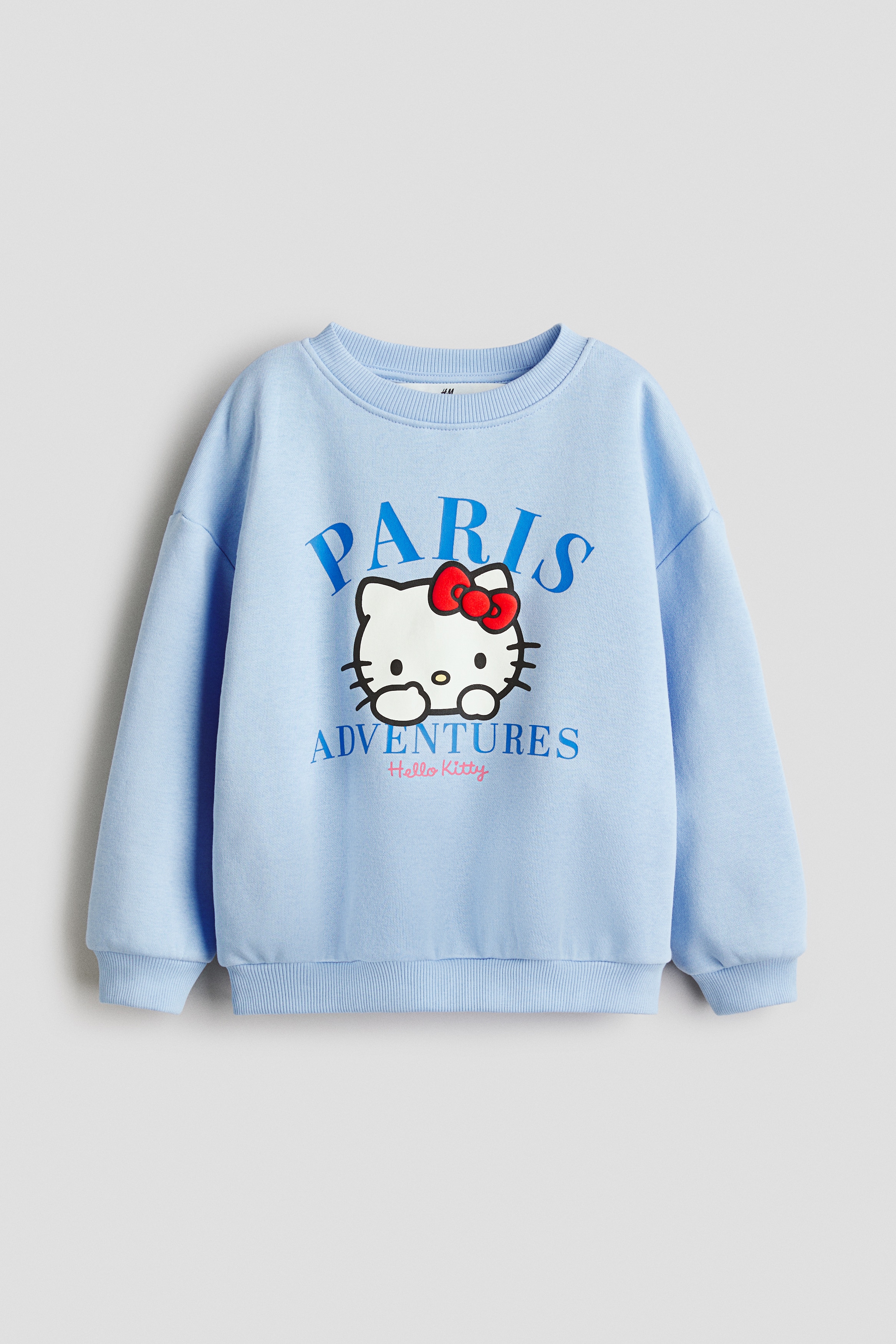 Printed sweatshirt - Light blue/Hello Kitty/Pink/Minnie Mouse/Cream/Hello Kitty/Pink/Peppa Pig/Light grey marl/Lilo & Stitch/Purple/Lilo & Stitch/Pink/Hello Kitty/White/Hello Kitty/White/Minnie Mouse/Yellow/Hello Kitty/Light pink/Squishmallows/Light blue/Cinnamoroll/Light beige/Lilo & Stitch/Cream/Hello Kitty/Light beige/Bambi/White/Peppa Pig/Pink/Lilo & Stitch/Light blue/Lilo & Stitch/Light blue/Frozen/Light purple/Pink/Cream/Minnie Mouse/Pink/Tweety/Cream/Bluey/Turquoise/Gabby's Dollhouse/White/Kuromi