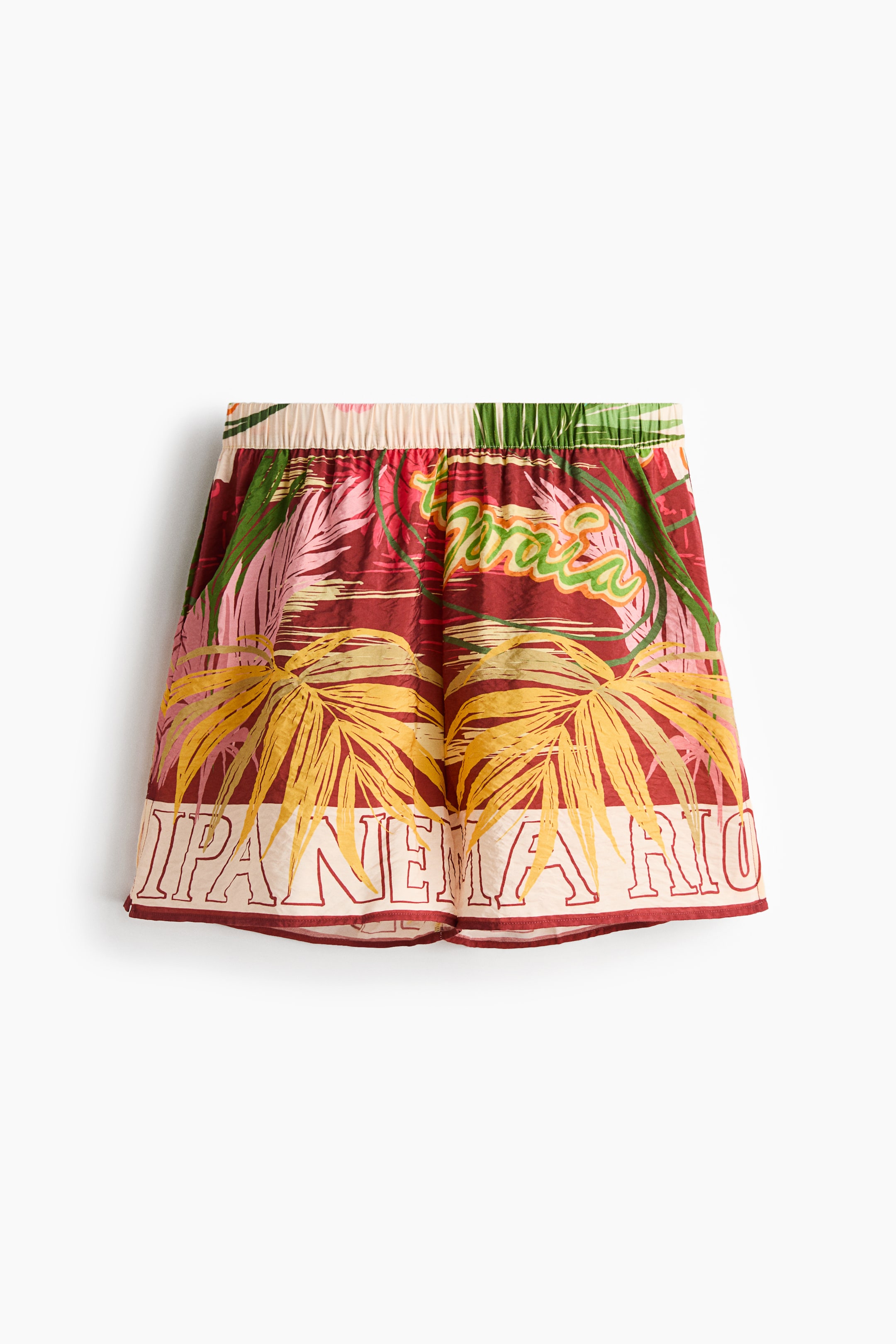 View larger image: Shorts are showcasing a vibrant tropical pattern in a viscose-blend weave, featuring an elasticated waist and diagonal side pockets. The front boasts a prominent "IPANEMA RIO" text band along the hem and a small slit at each side.