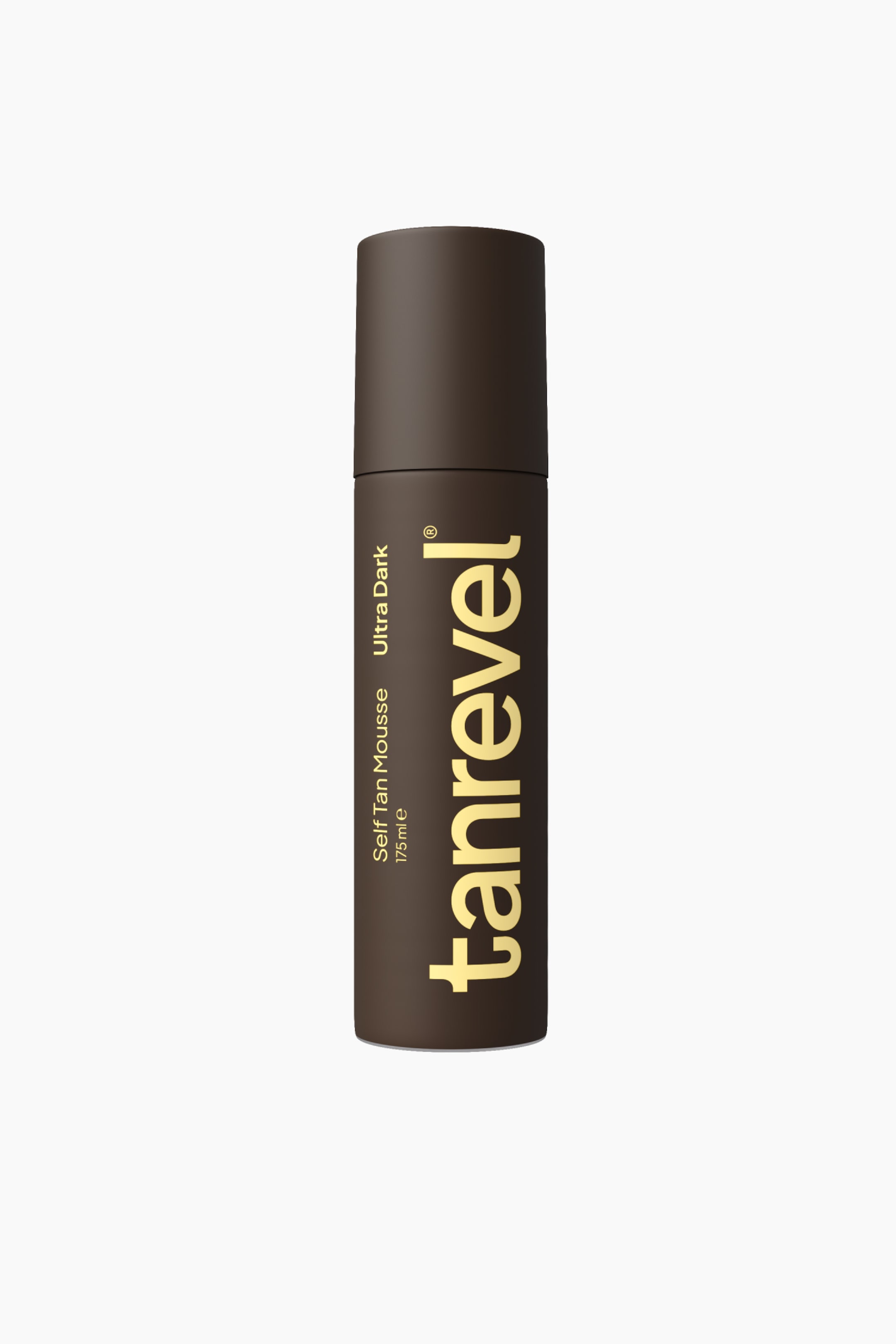 Se større billede: Self Tan Mousse Ultra Dark står oprejst i en cylindrisk, mørkebrun flaske med matchende mat hætte. Forsiden af flasken viser brandnavnet "tanrevel" lodret i store, gyldengule små bogstaver sammen med mindre lodret tekst med "Self Tan Mousse" og "Ultra Dark".