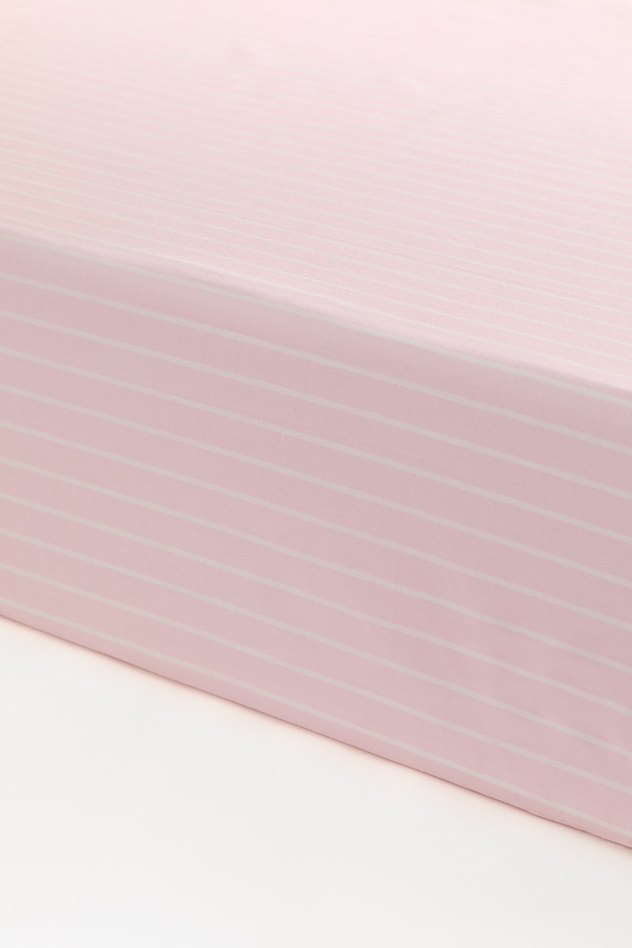 Visualizza immagine più grande: Lenzuolo con angoli da culla in percalle di cotone - Rosa chiaro/righe - HOME | H&M IT 1