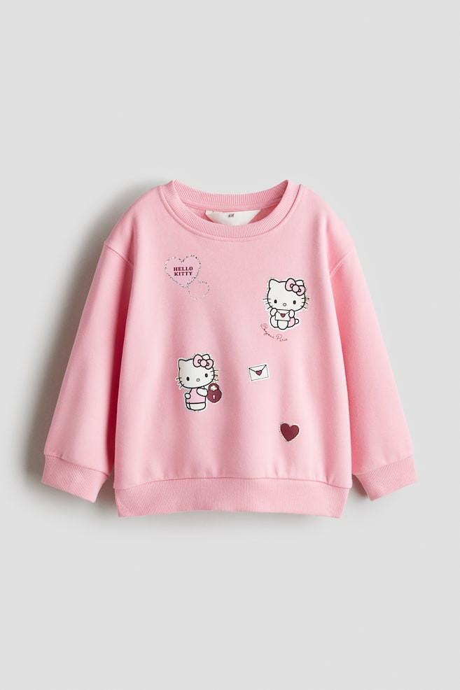 Sweatshirt with Motif - Pink/Hello Kitty/Light pink/CapyFun/Cream/Lilo & Stitch/Light blue/Frozen/White/Frozen/White/Disney Princesses/White/Minnie Mouse/Cream/SmileyWorld®/Black/Lilo & Stitch - 1
