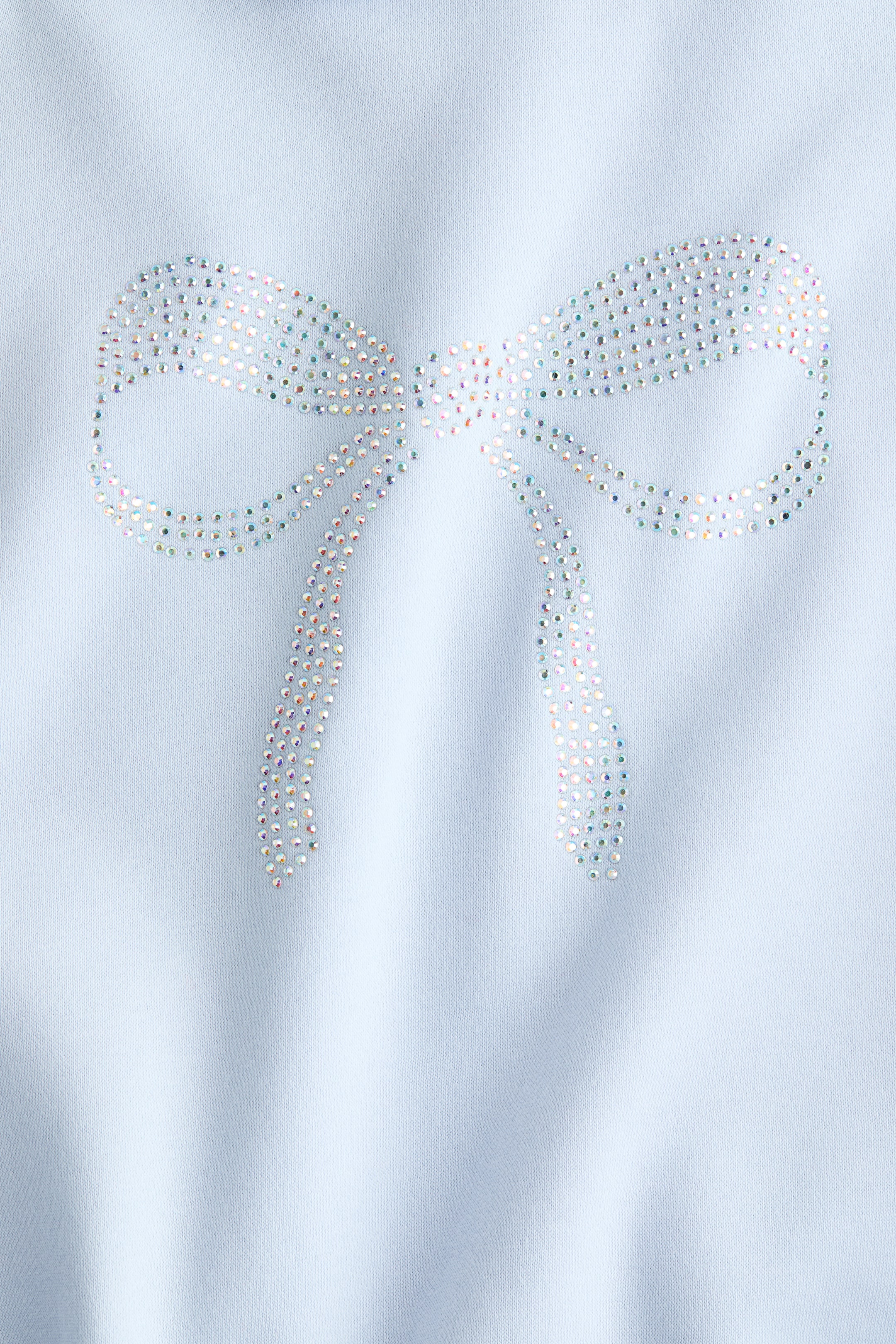 View larger image: Oversized motif-detail hoodie - Light blue/Bow - Kids | H&M IE 5