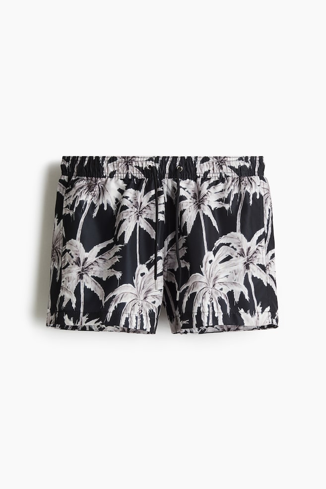 Gemusterte Badeshorts - Schwarz/Palmen - 1