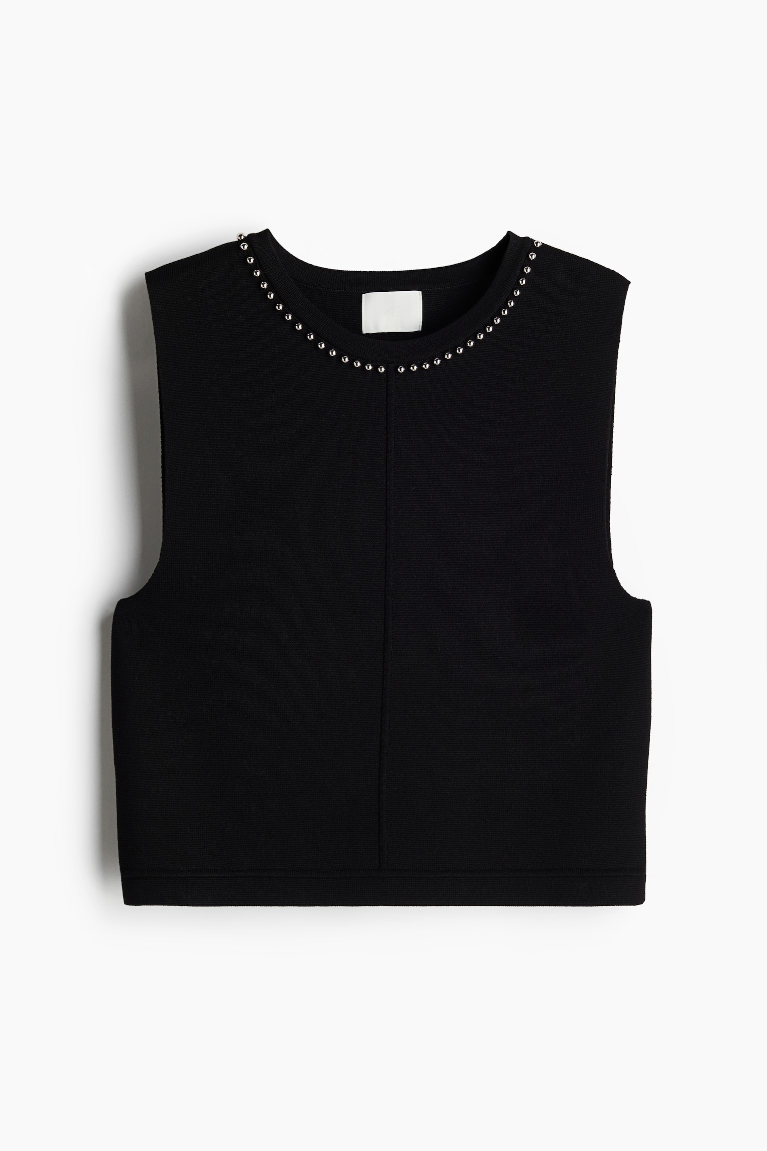 christmas party outfit trends 2024 - H&m Short, fitted vest top in a dense knit with a round neckline detailed with shiny beads